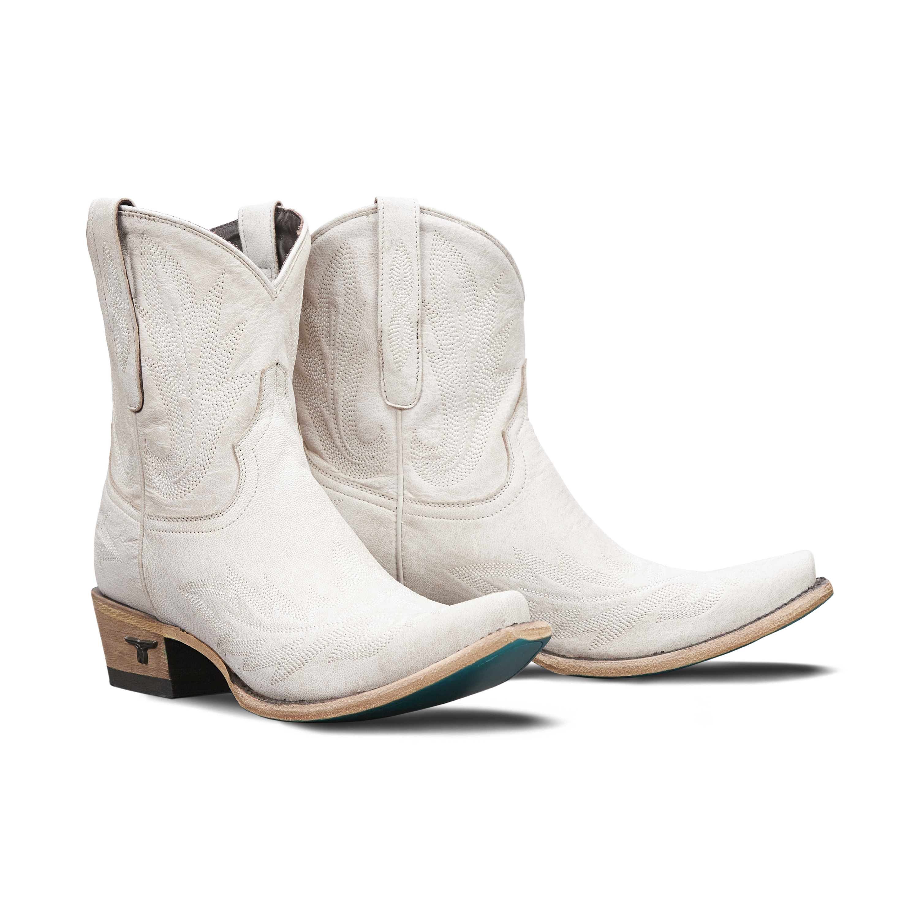 Pair of white booties with detail on a transparent background