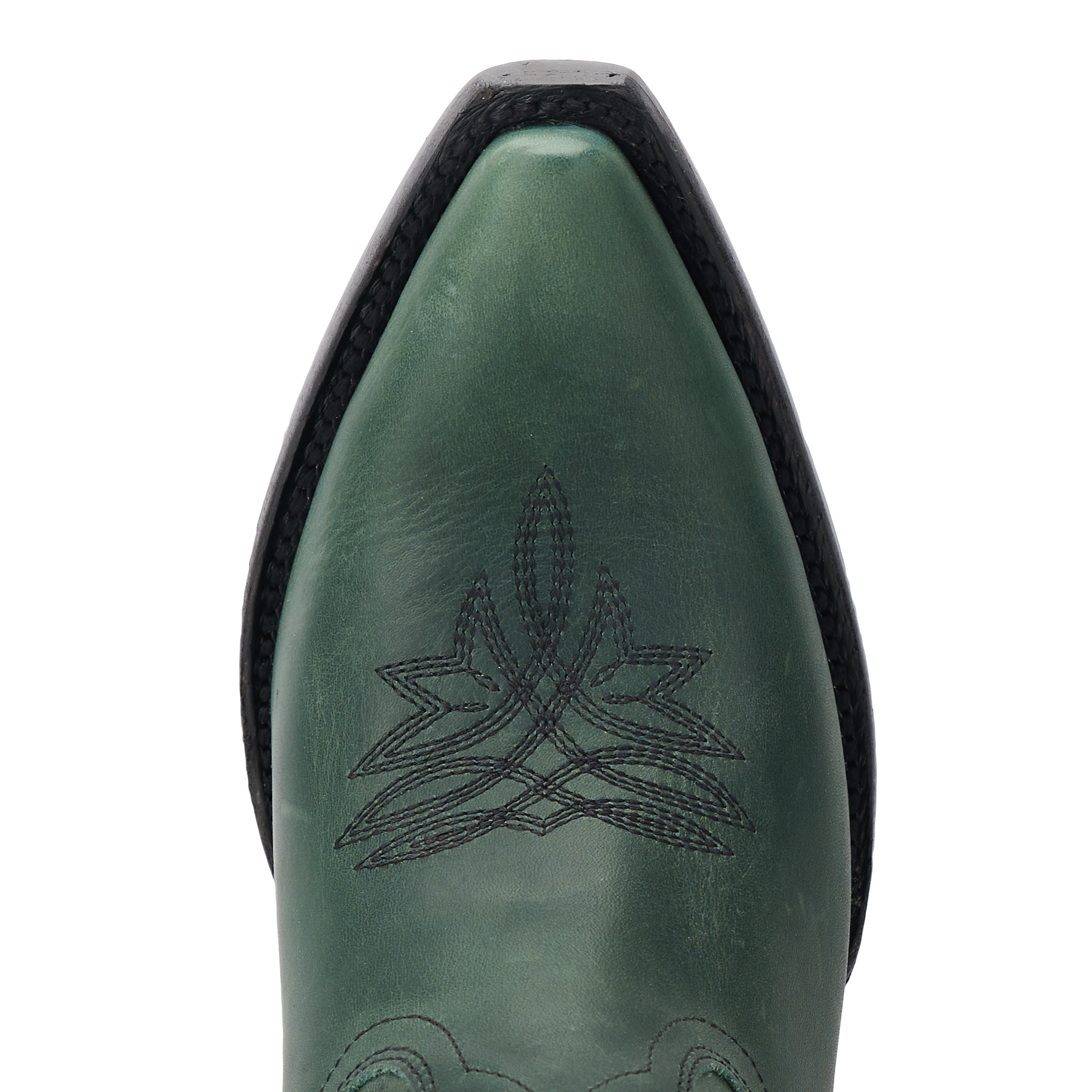 Close-up of a emerald green cowboy boot toe with decorative stitching in a starburst pattern and a black welt