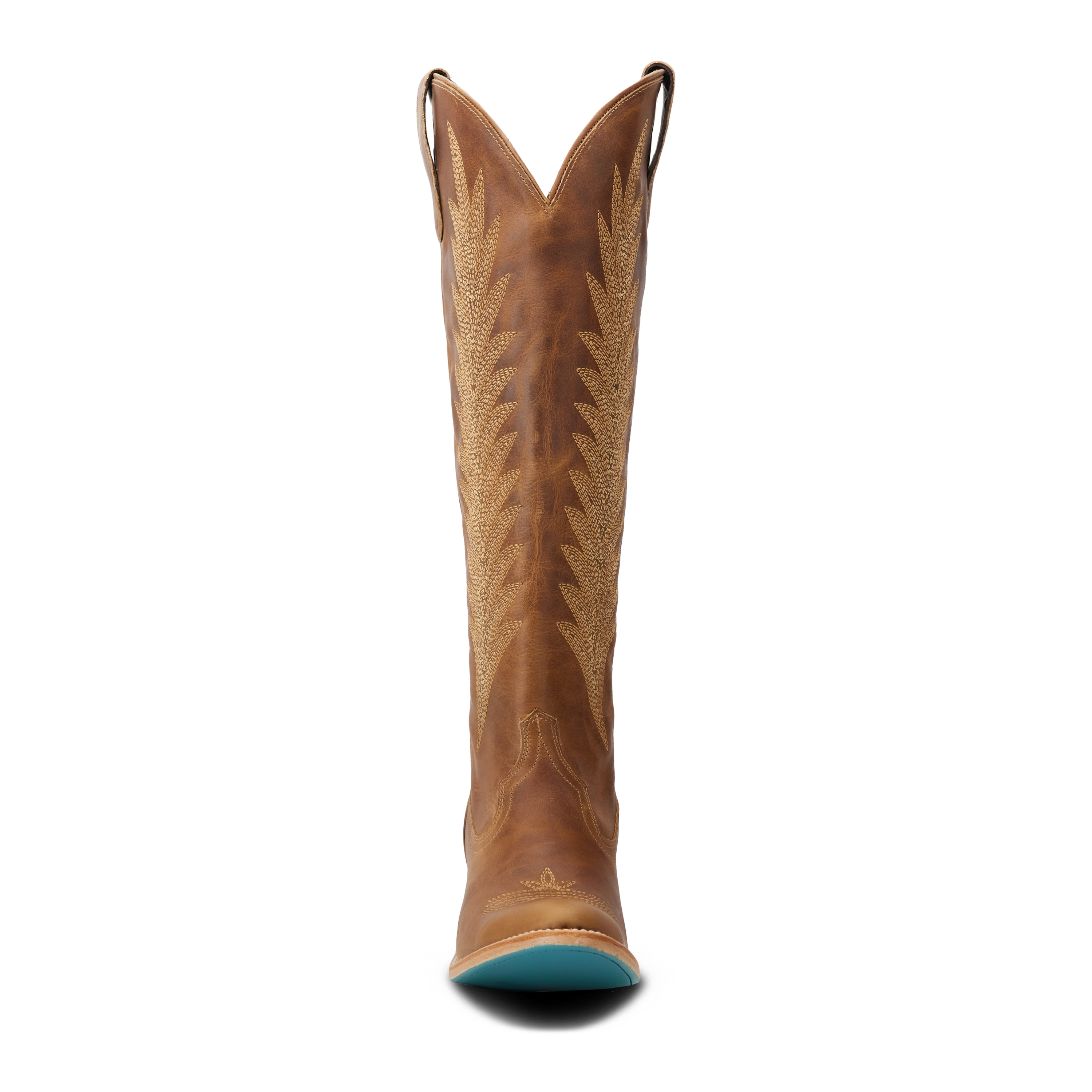 Front view of a tall brown cowboy boot with a V-cut top and pull straps, featuring intricate stitching along the shaft and a turquoise sole peeking out from the toe
