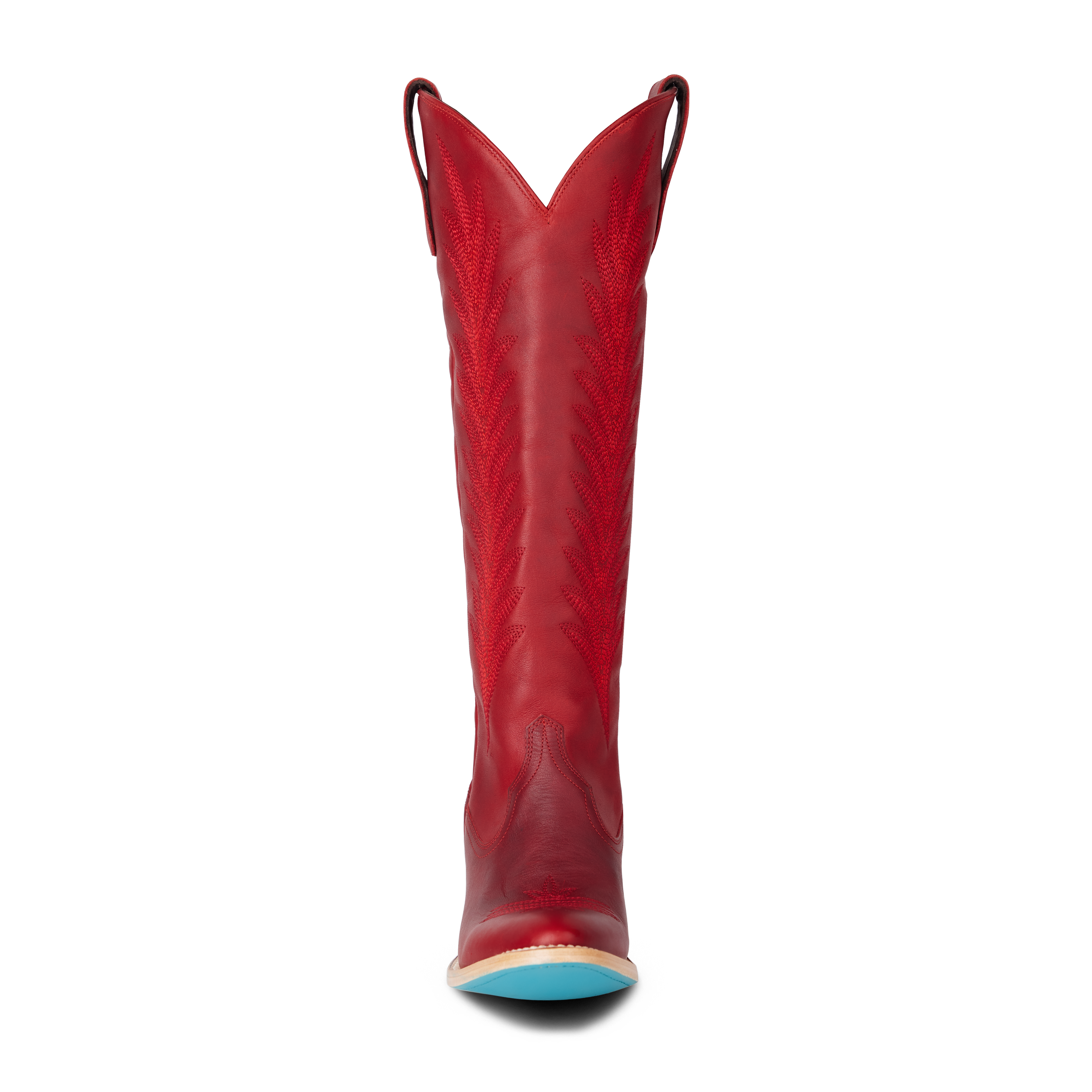 Front view of a tall red cowboy boot with decorative stitching and a pointed toe with a turquoise bottom, on a transparent background