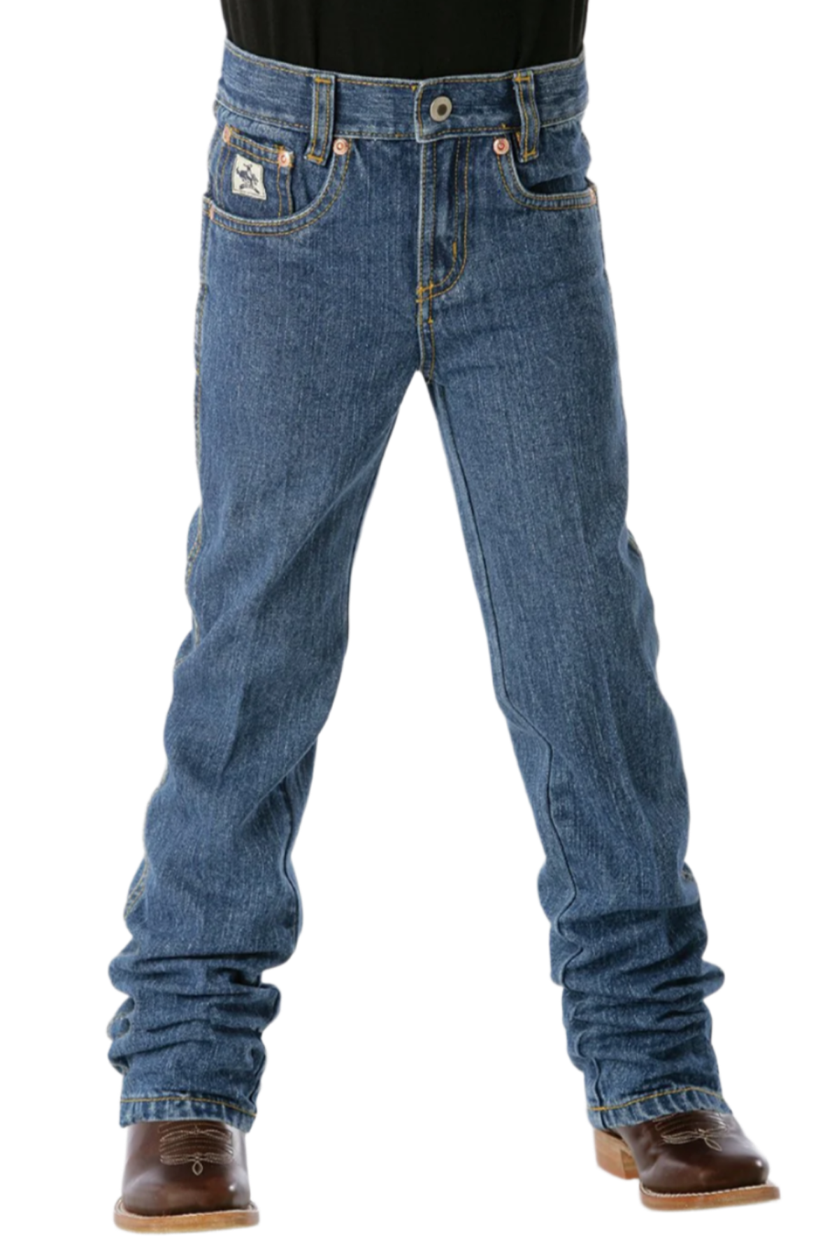 Front view of boy wearing medium wash Cinch slim fit jeans with cowboy boots