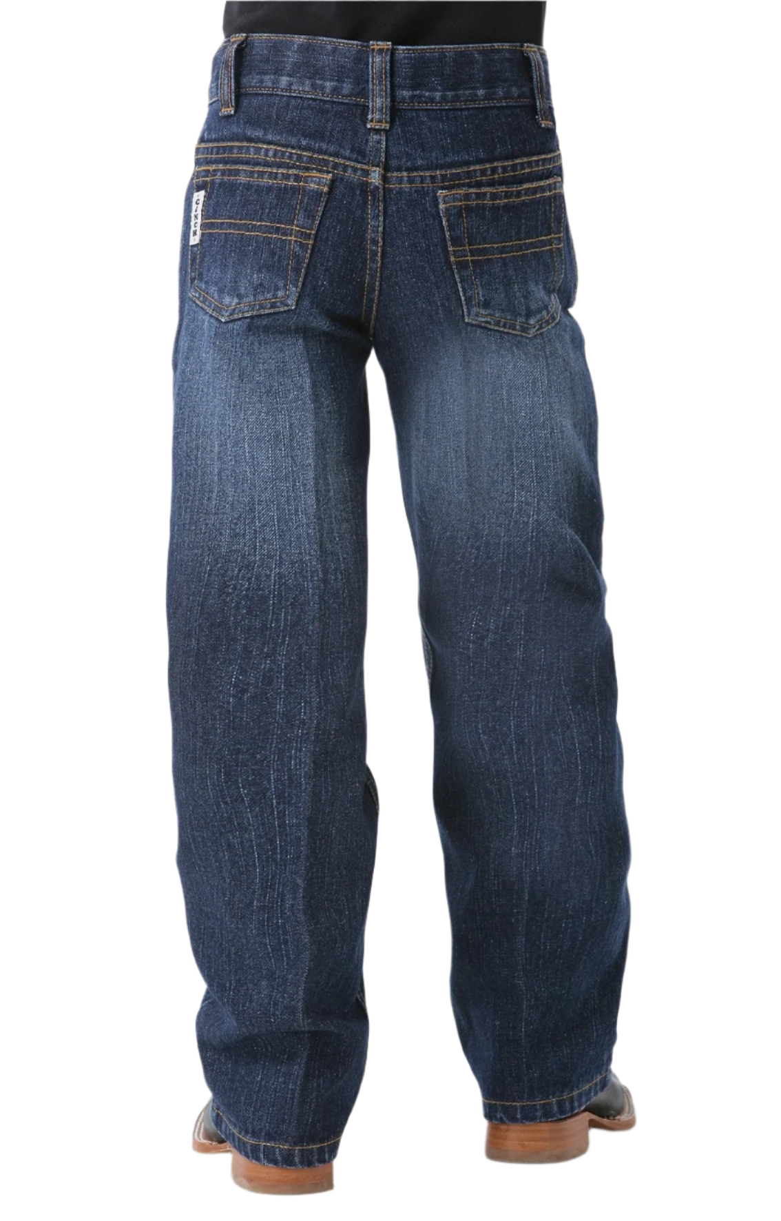 Boy wearing dark wash jeans and boots