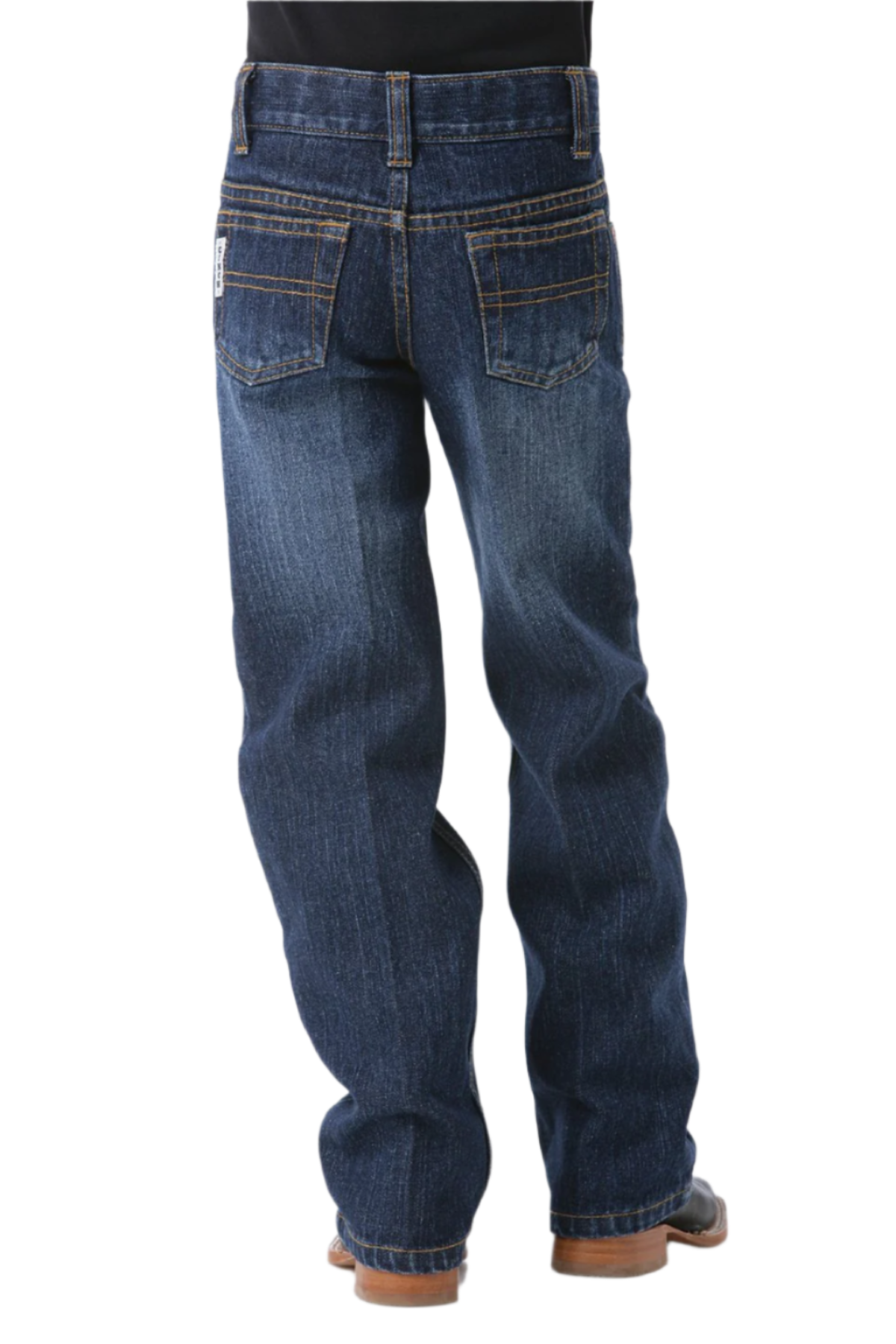 Back view of dark wash Cinch boys’ slim fit jeans worn with boots