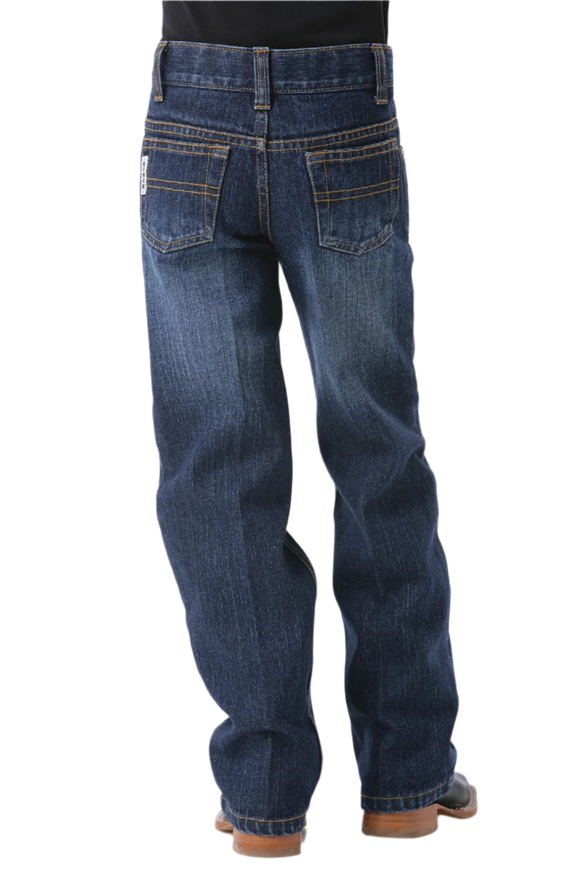 Boy wearing dark wash jeans and boots