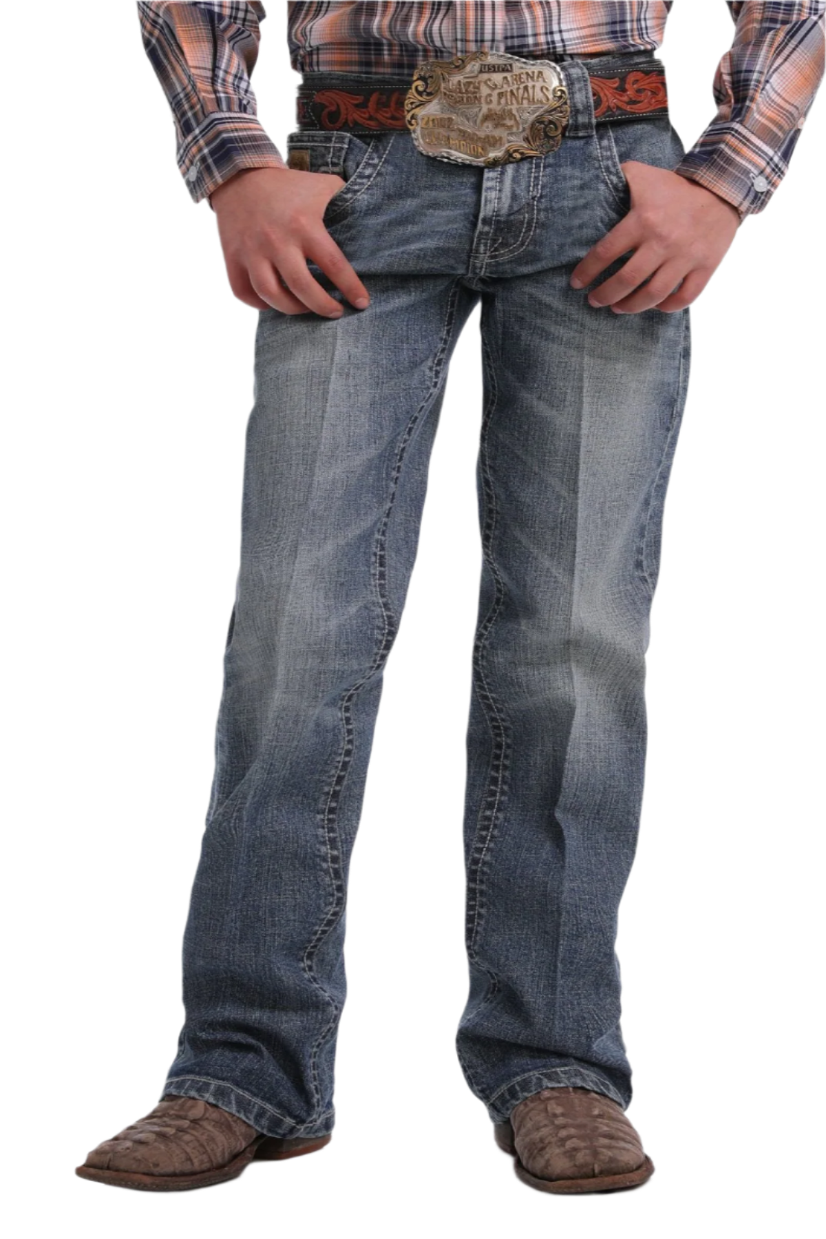 Boy wearing medium wash jeans and boots with a long sleeve shirt and western belt