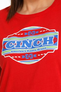 Close-up of a woman wearing a red t-shirt with a large 'Cinch' graphic in the middle