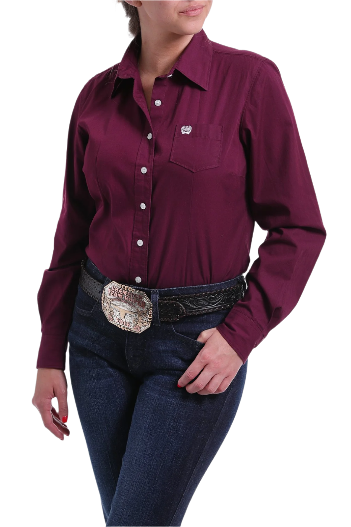 Woman wearing a burgundy button down shirt with jeans and a western belt