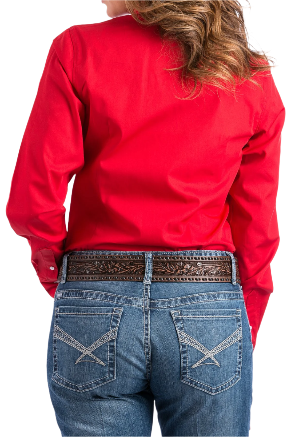 Back view of a woman wearing a red button down shirt with jeans and a western belt