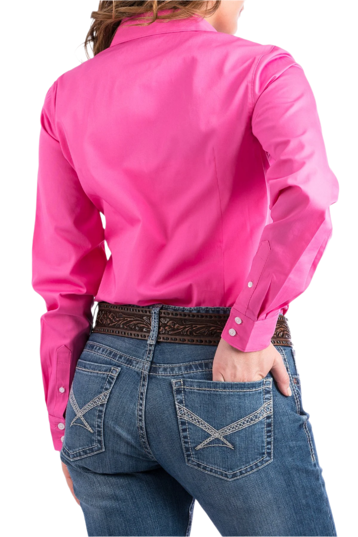 Back view of a woman wearing a pink button down shirt with jeans and a western belt