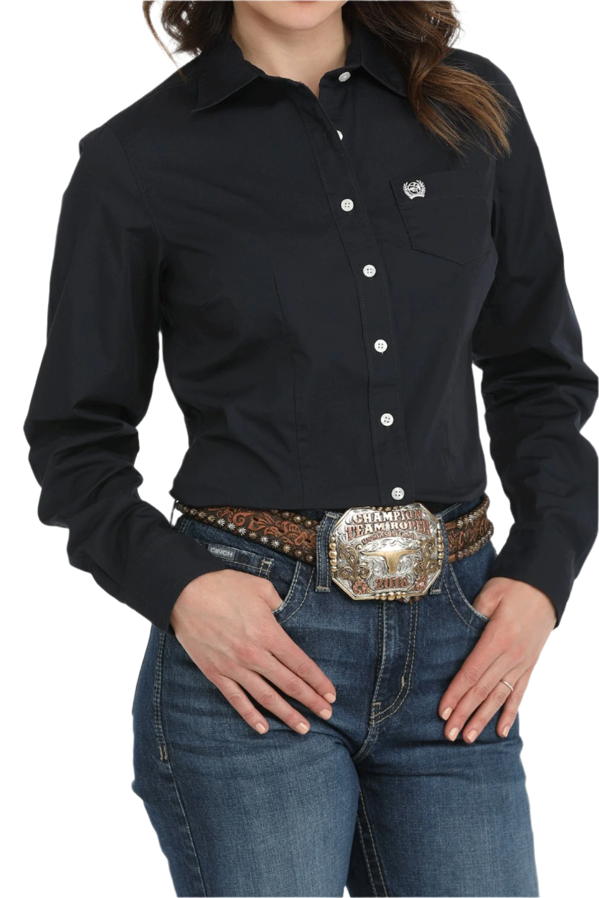 Woman wearing a black button down shirt with jeans and a western belt