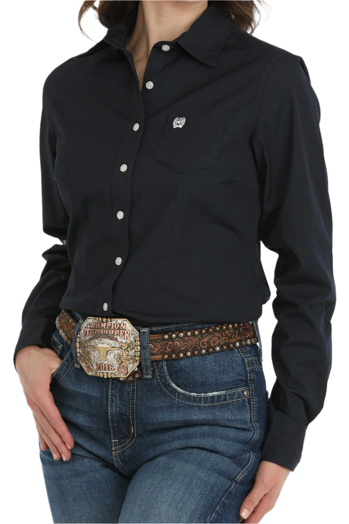 Woman wearing a black button down shirt with jeans and a western belt