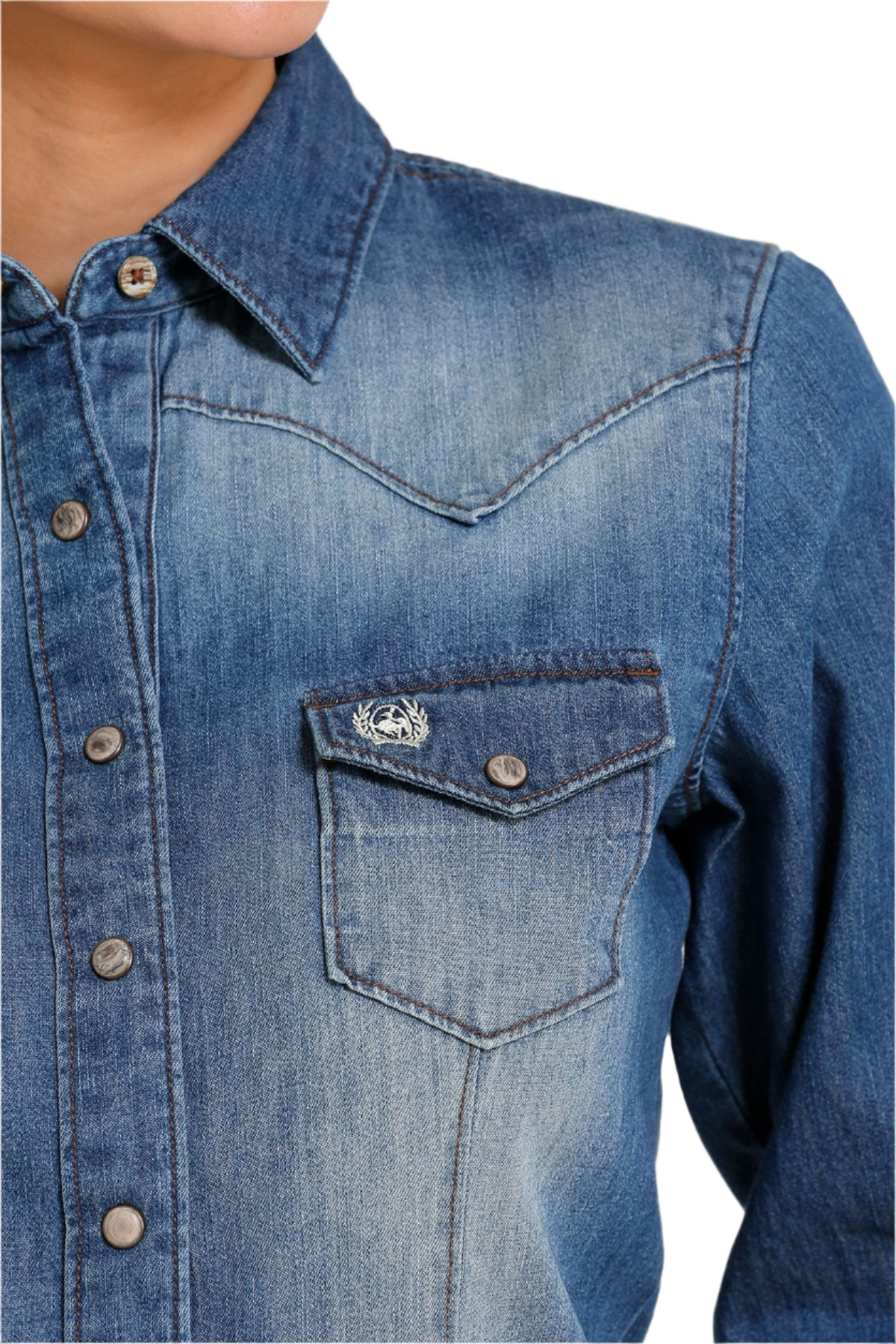 Close-up of a woman wearing a dark stone wash button down shirt