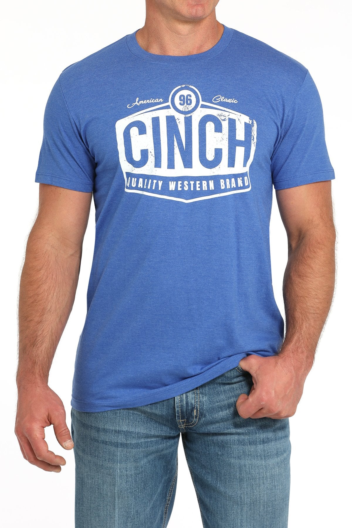 Front view of a man wearing a blue short-sleeve t-shirt with a large white CINCH graphic, paired with blue jeans displayed on a white background.