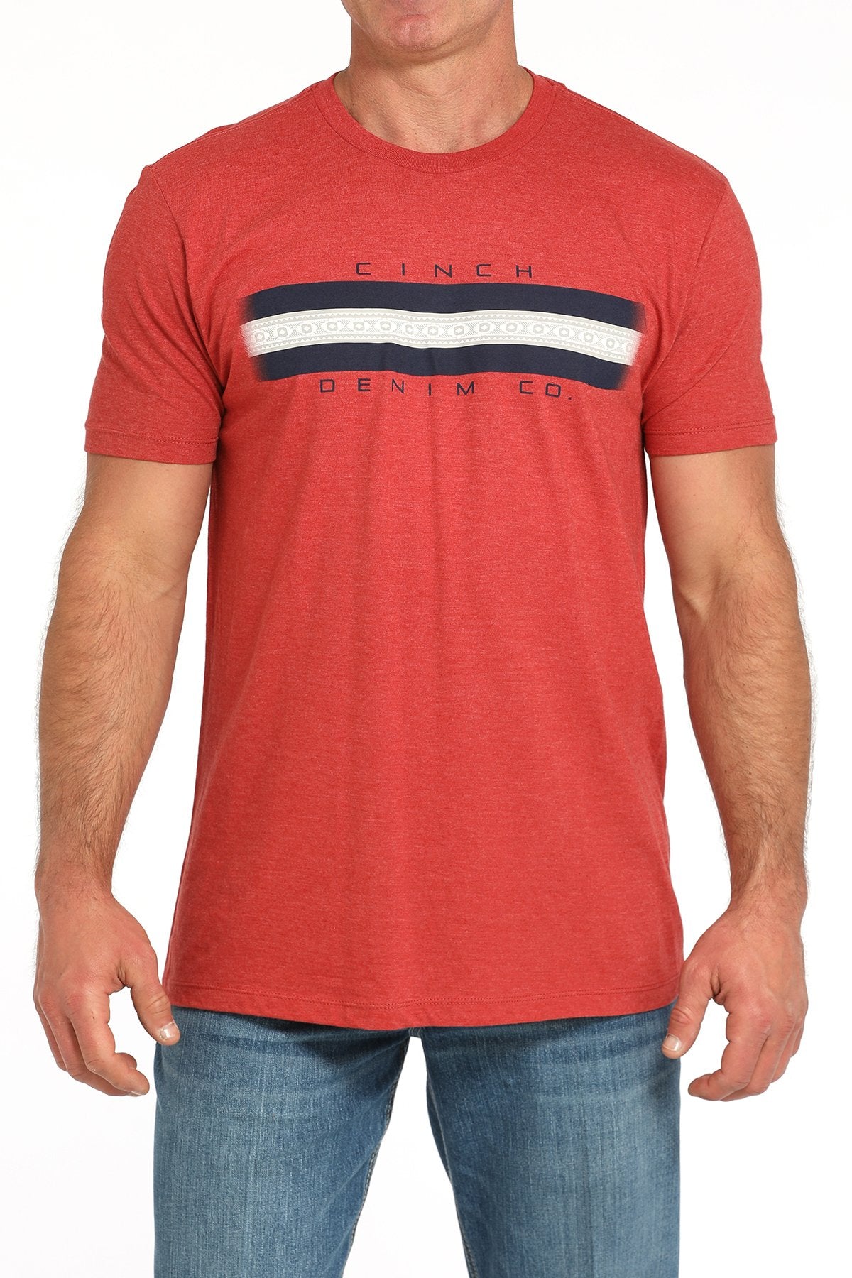 Front view of a man wearing a red short-sleeve t-shirt with a horizontal navy and white stripe graphic across the chest, paired with blue jeans displayed on a white background.