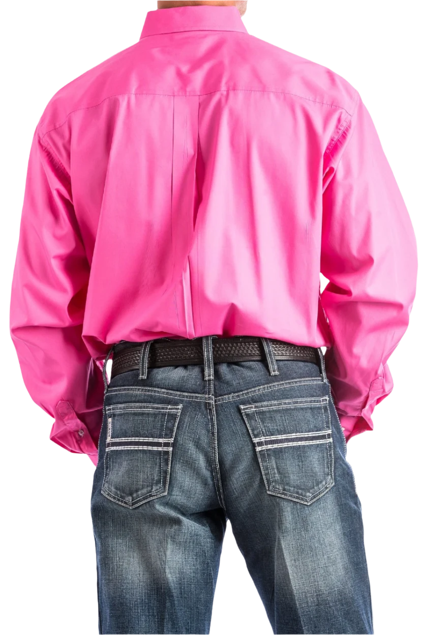 Back view of a man wearing a long-sleeve pink Western shirt with a button-down collar, paired with blue jeans and a belt