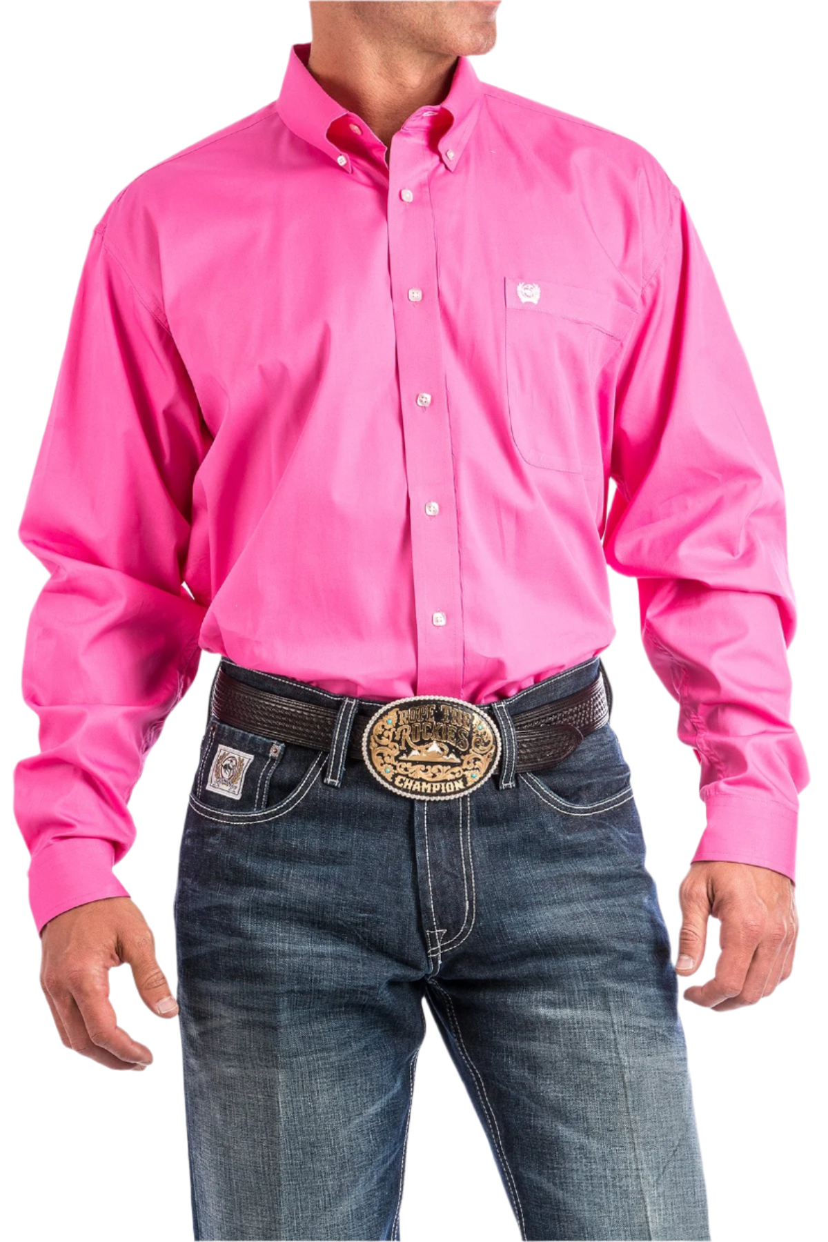 A man wearing a long-sleeve pink Western shirt with a button-down collar, paired with blue jeans and a belt with a decorative buckle.