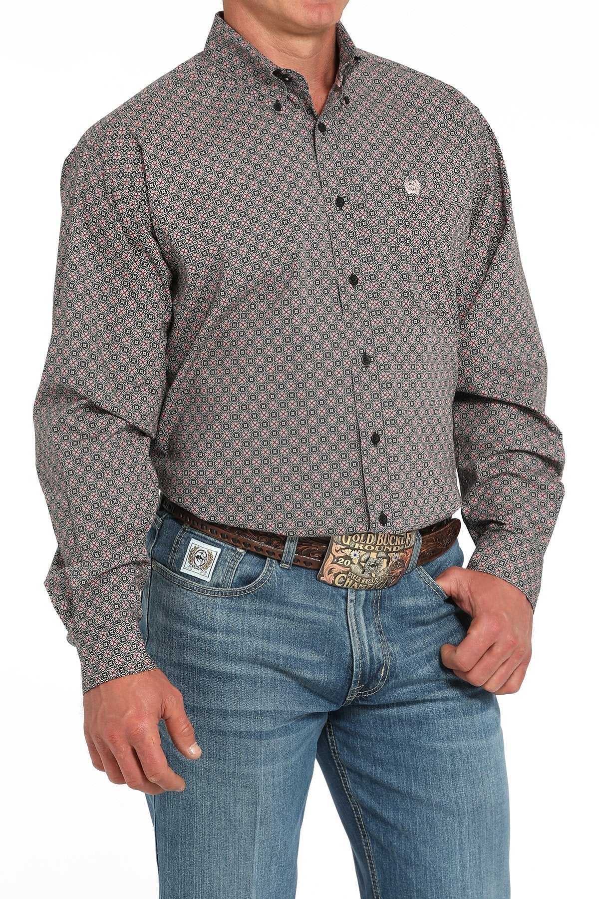 Man wearing a gray long sleeve button-down with jeans and a belt