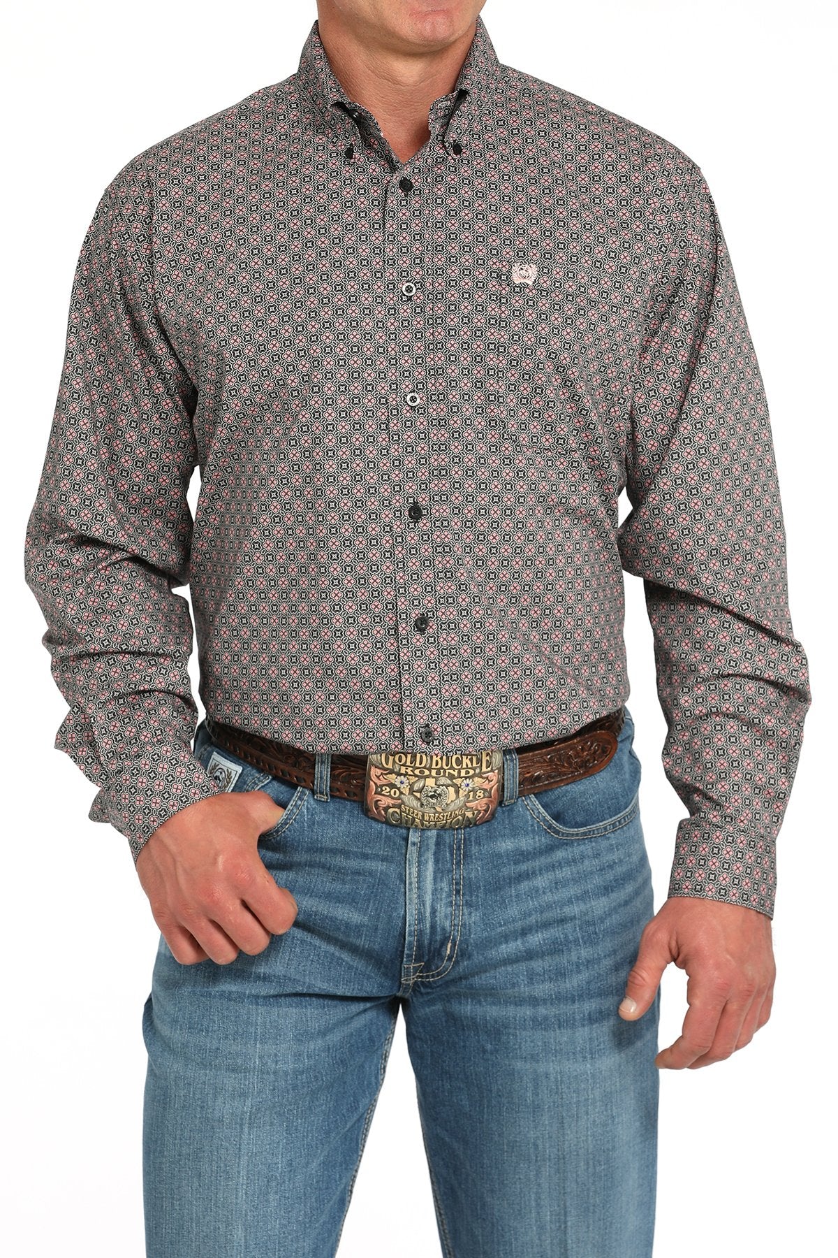 Man wearing a gray long sleeve button-down with jeans and a belt