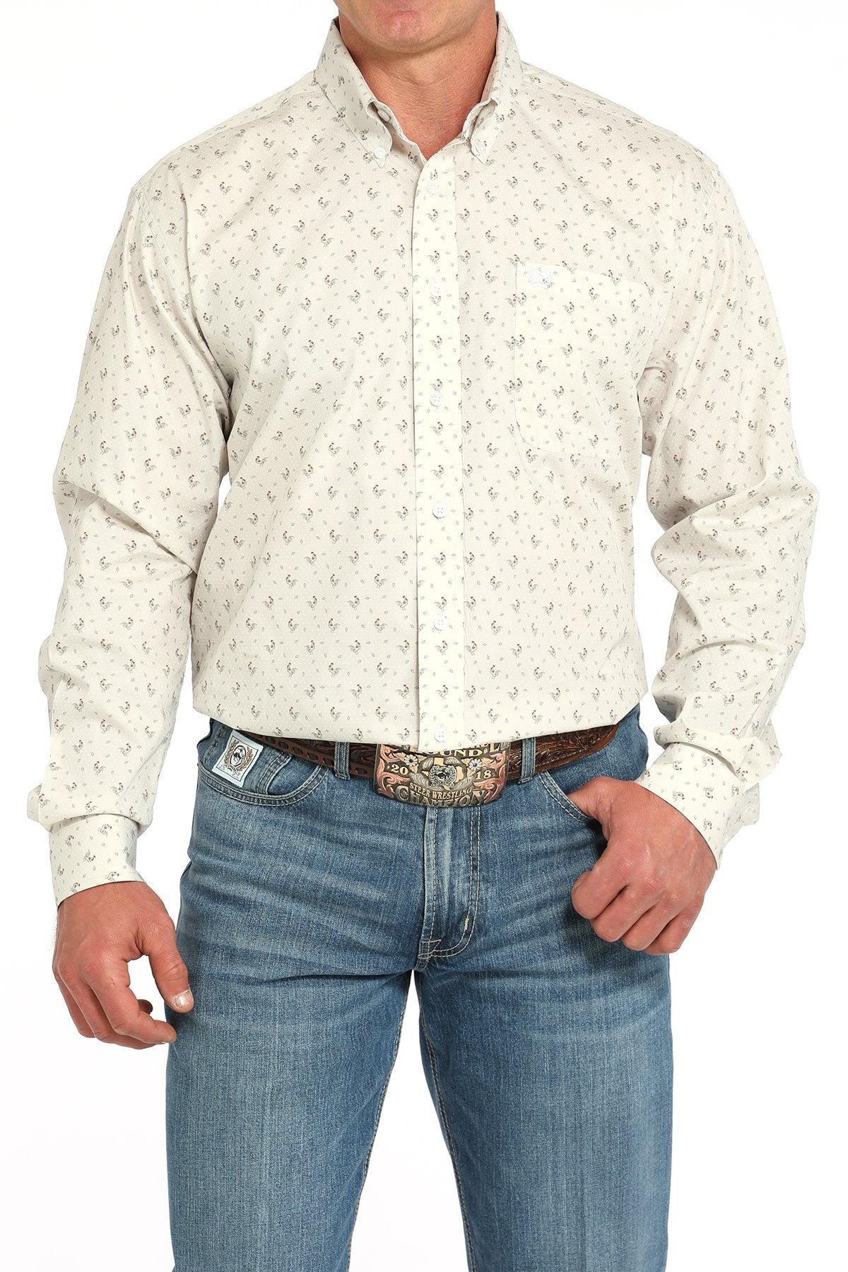 Front view of a man wearing a gray long-sleeve button-down shirt with a small rooster print pattern, paired with blue jeans and a western belt buckle displayed on a white background.