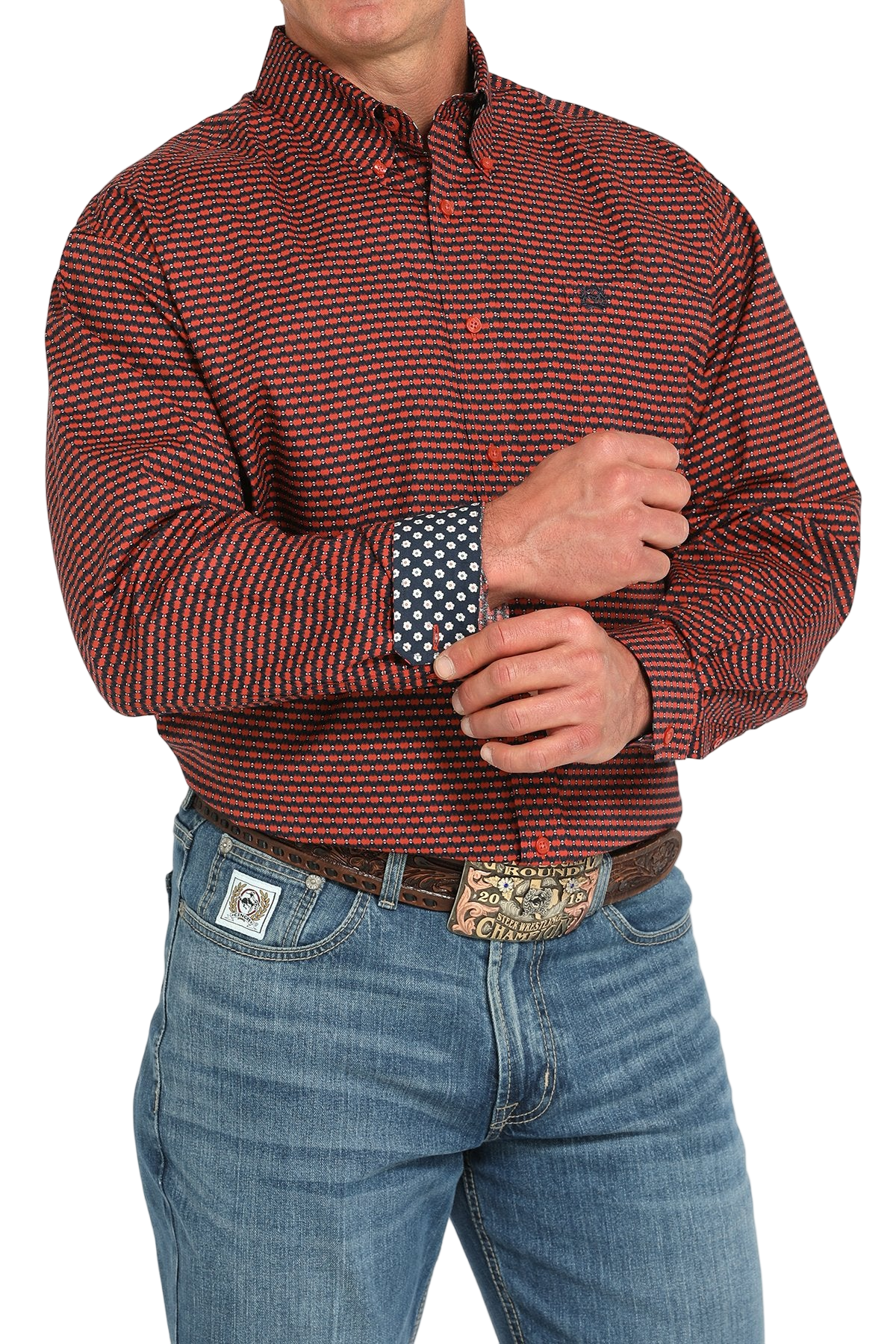 Man wearing a patterned maroon long sleeve button-down shirt with contrasting cuffs and jeans on a transparent background