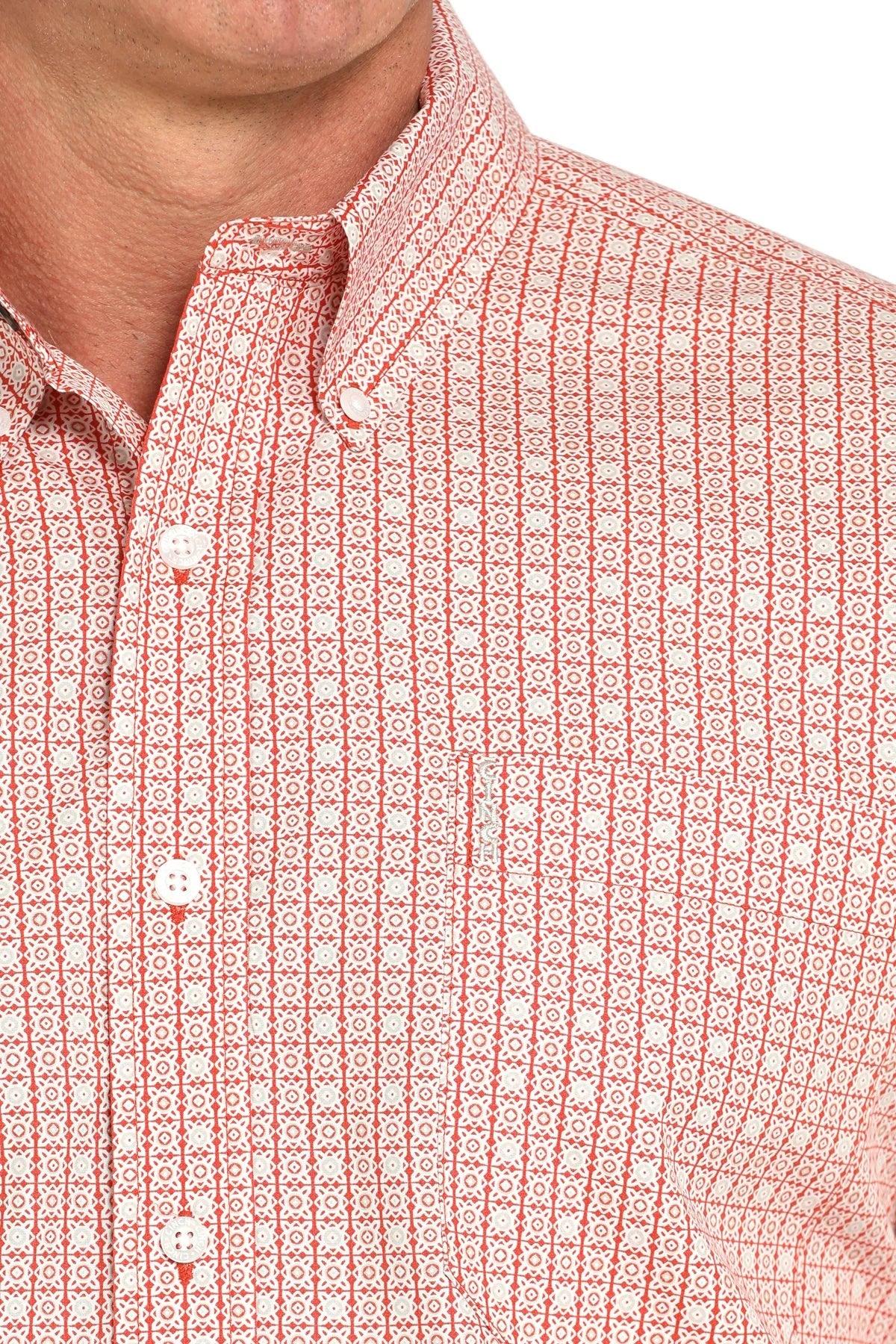 Close-up of a red geometric print button-down shirt with button-down collar