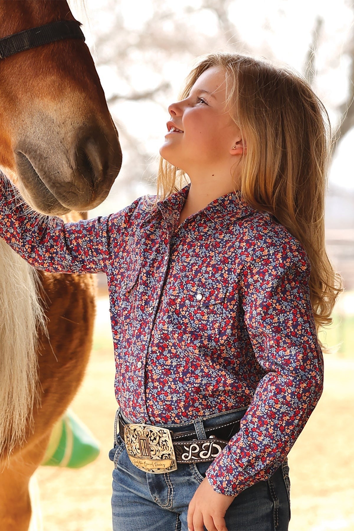 Go West Supply girls' blue floral print long sleeve western shirt with button-down front and pearl snaps.