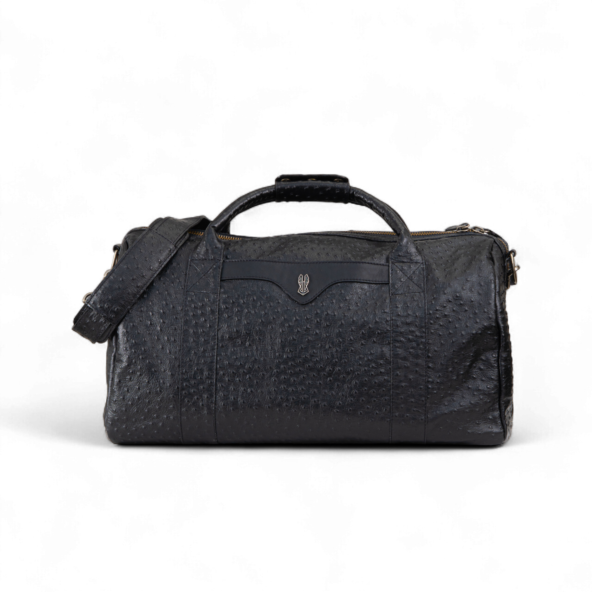 Black ostrich-print duffel bag with dual top handles, a detachable shoulder strap, and a gold zipper. A small metallic emblem is featured on the front center panel
