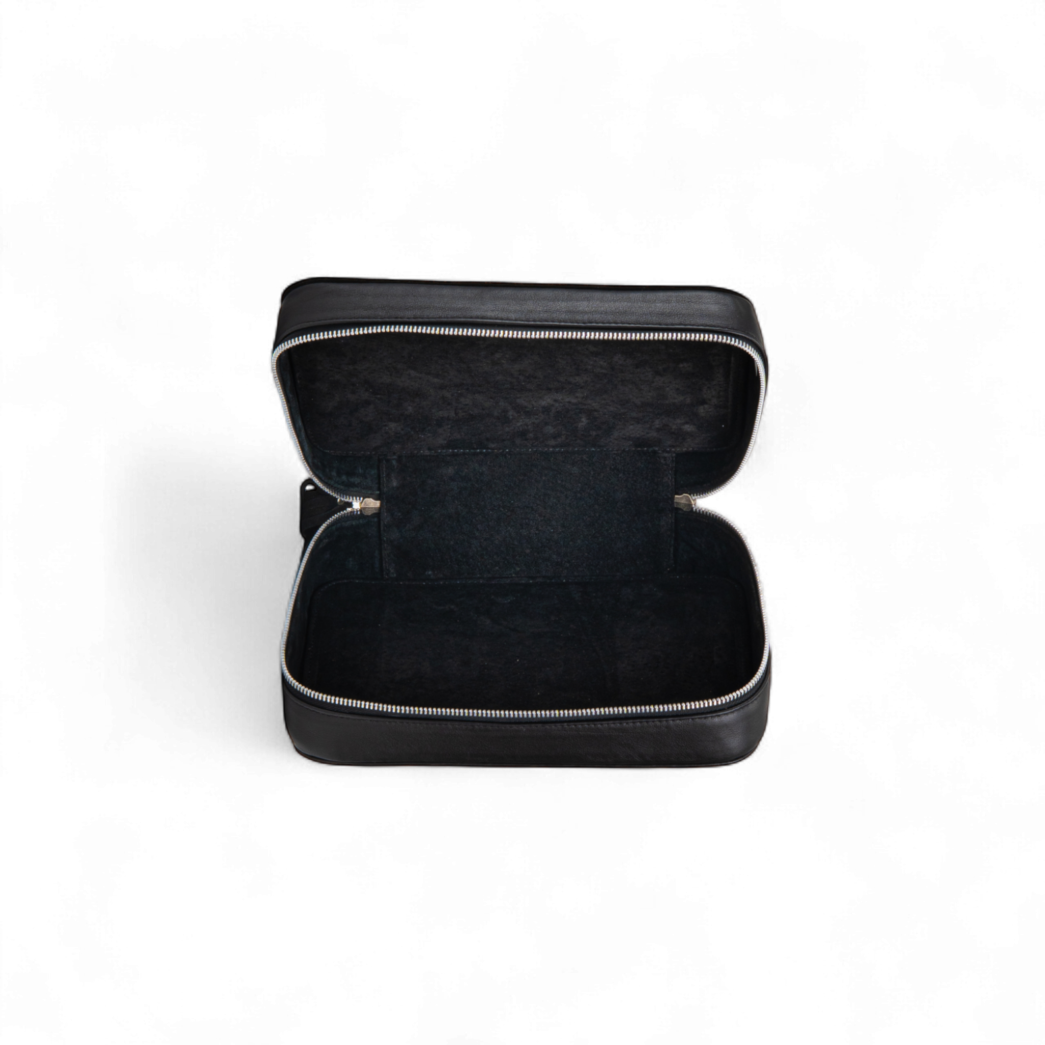 Black rectangular toiletry bag shown open with a spacious interior, smooth lining, and a full zipper around the edges