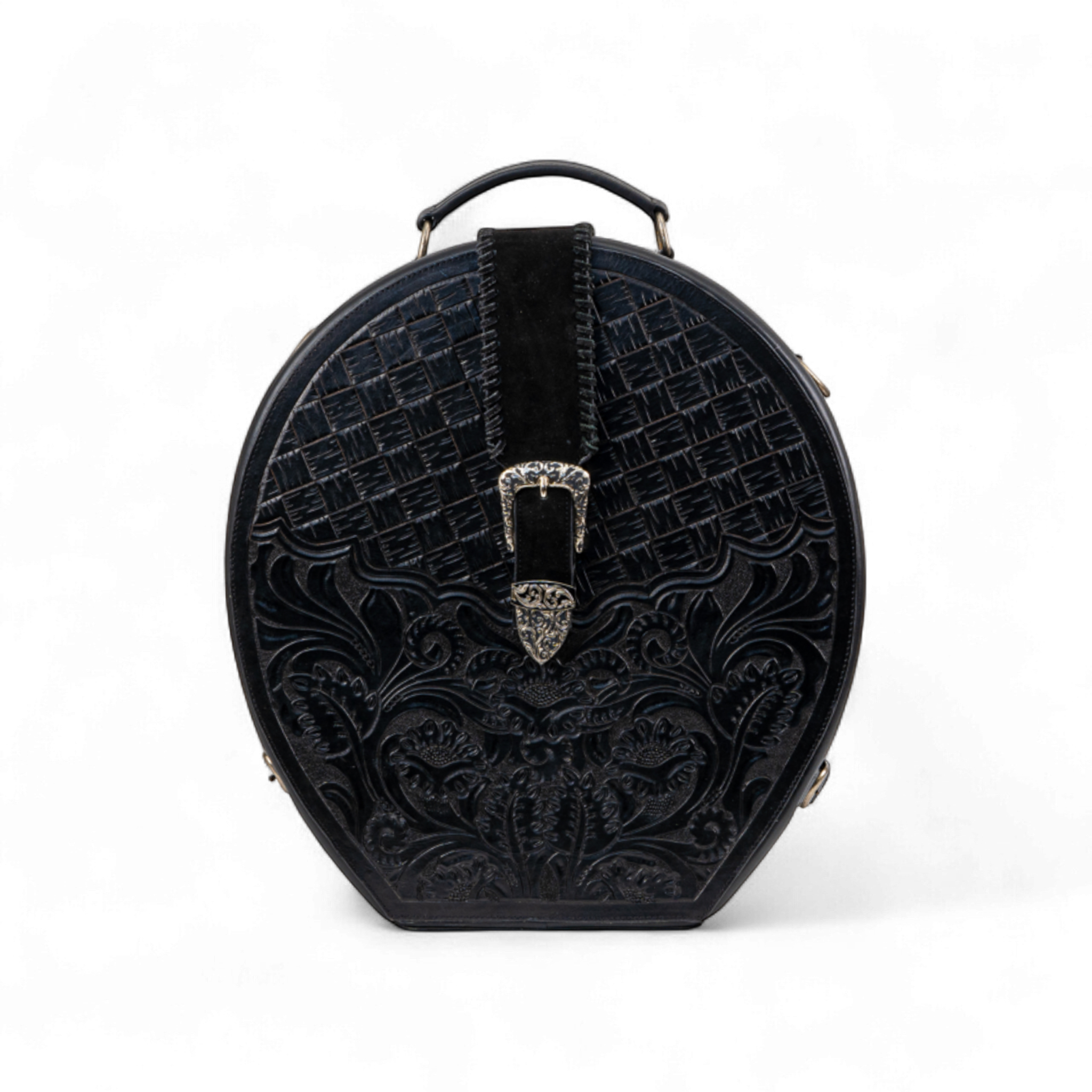 Black tooled leather hat case with a rounded top and basket-weave and floral patterns. A silver ornate buckle is centered on a suede strap, with a small top handle for carrying