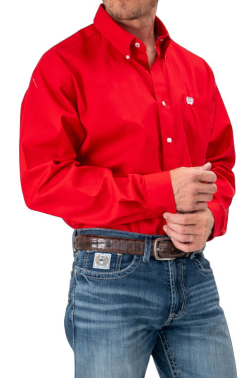 Man wearing a red long sleeve button-down shirt and jeans on a transparent background