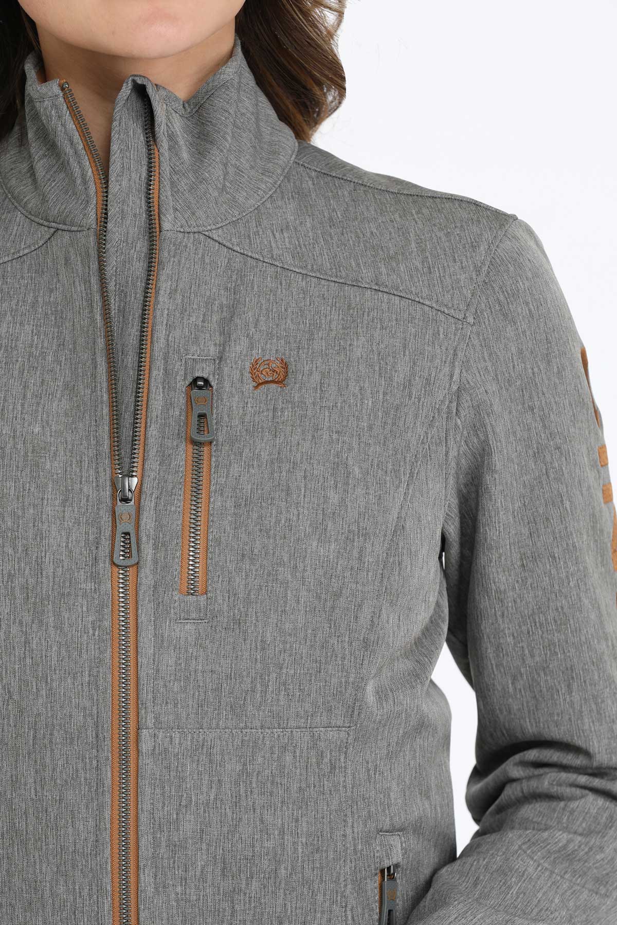 Close-up of a woman wearing a gray jacket 