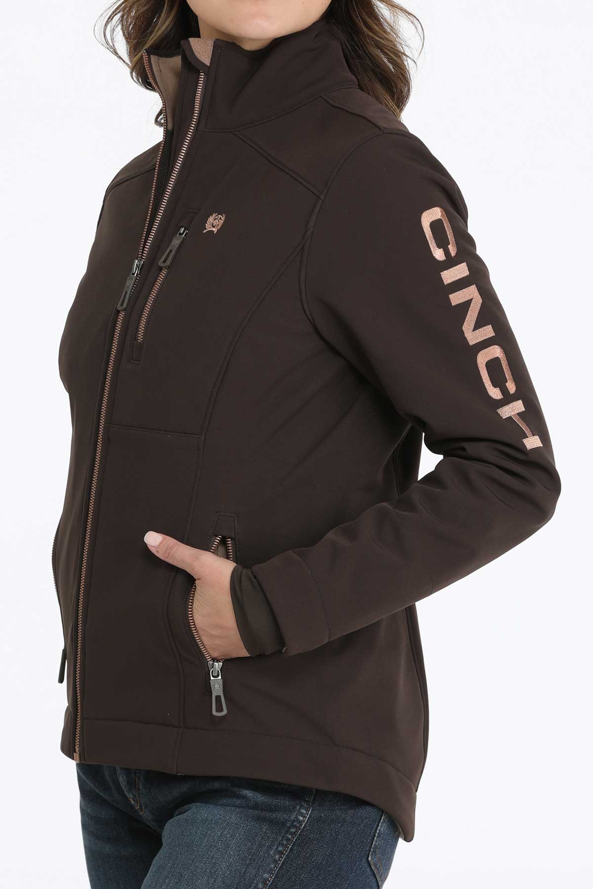 Woman wearing a brown jacket with jeans 
