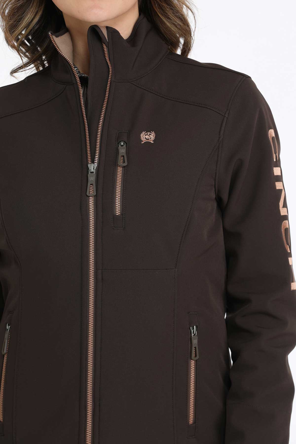 Close-up of a woman wearing a brown jacket 