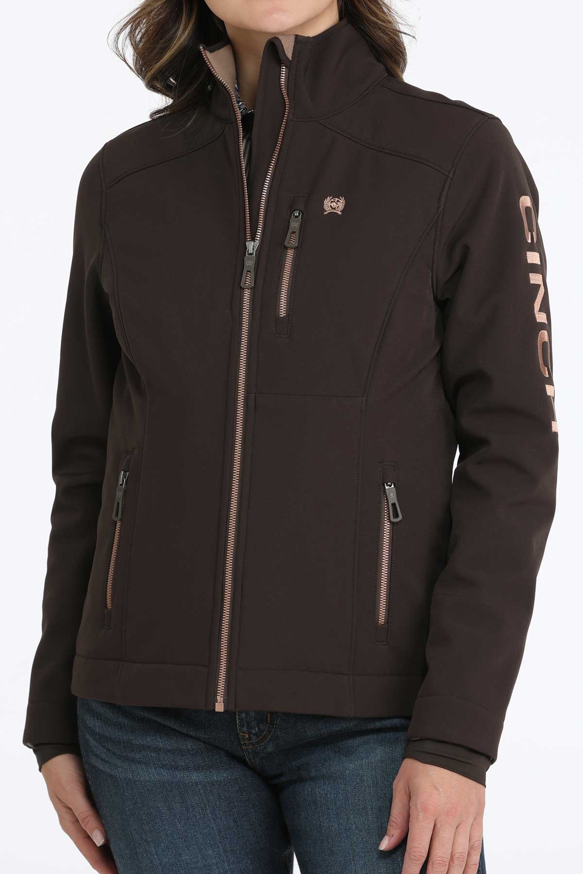 Woman wearing a brown jacket with jeans 