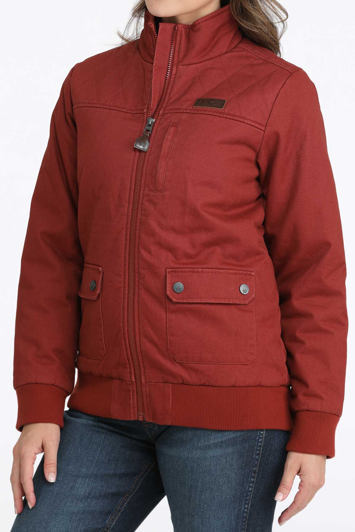 Woman wearing a red jacket with jeans 