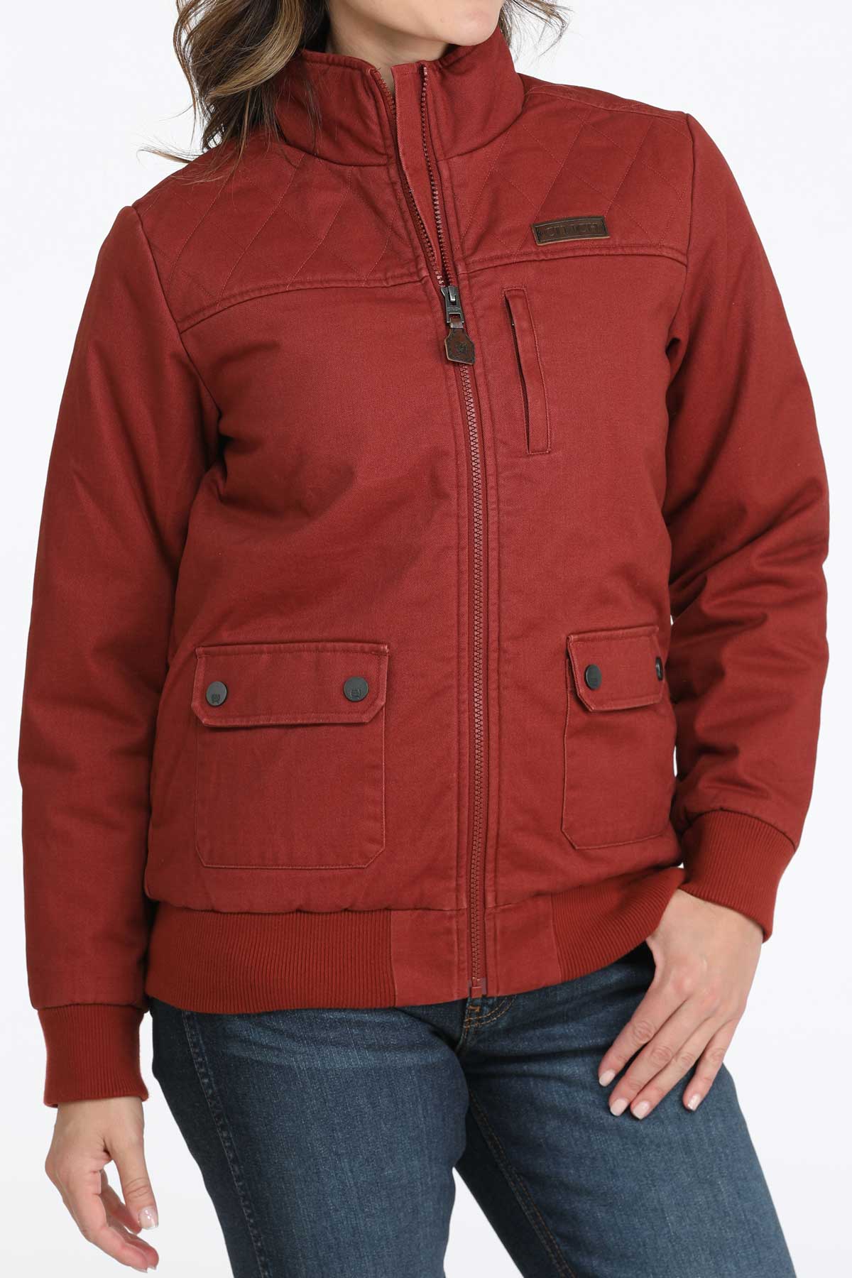 Woman wearing a red jacket with jeans 