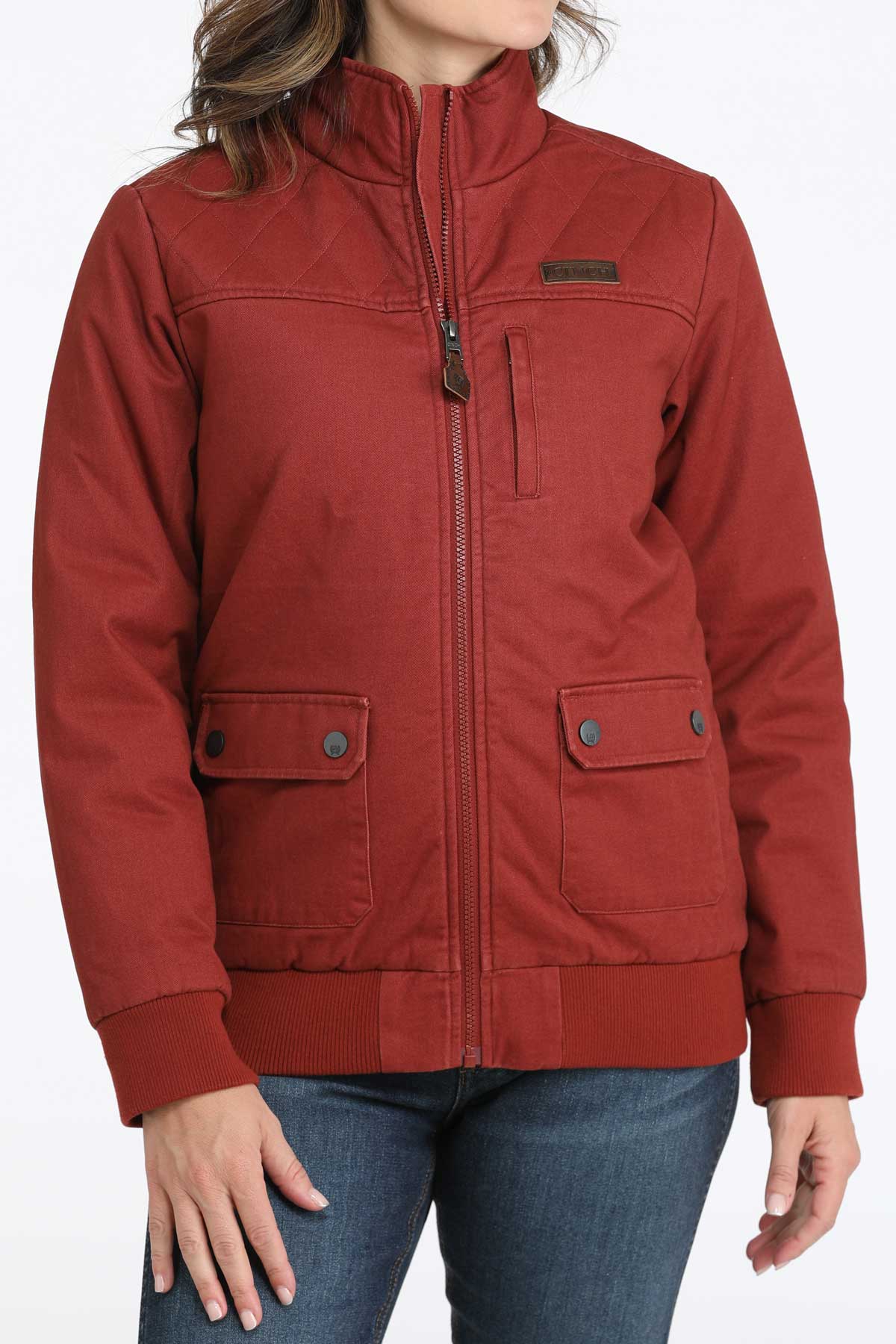 Woman wearing a red jacket with jeans 