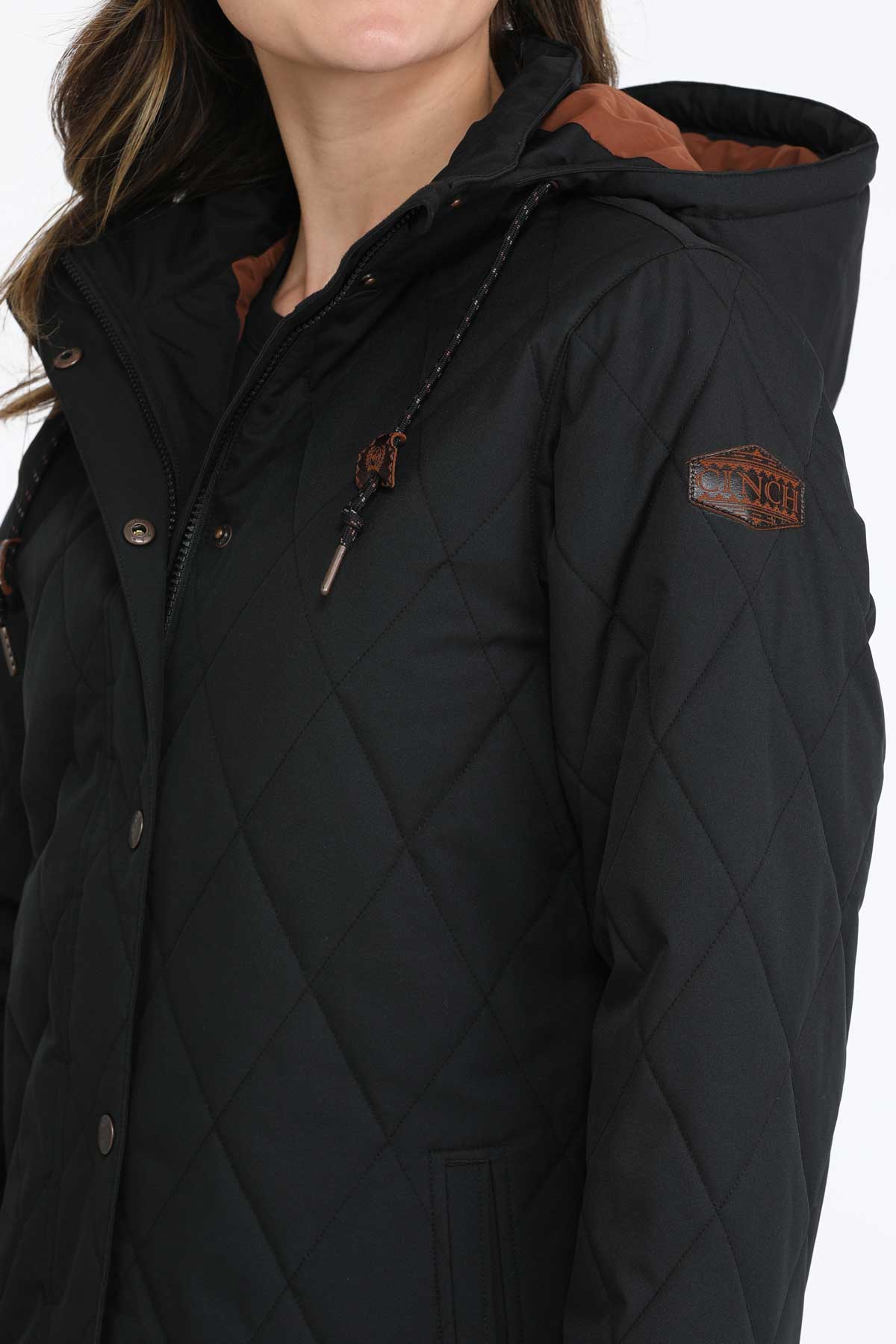 Close-up of a woman wearing a black coat 