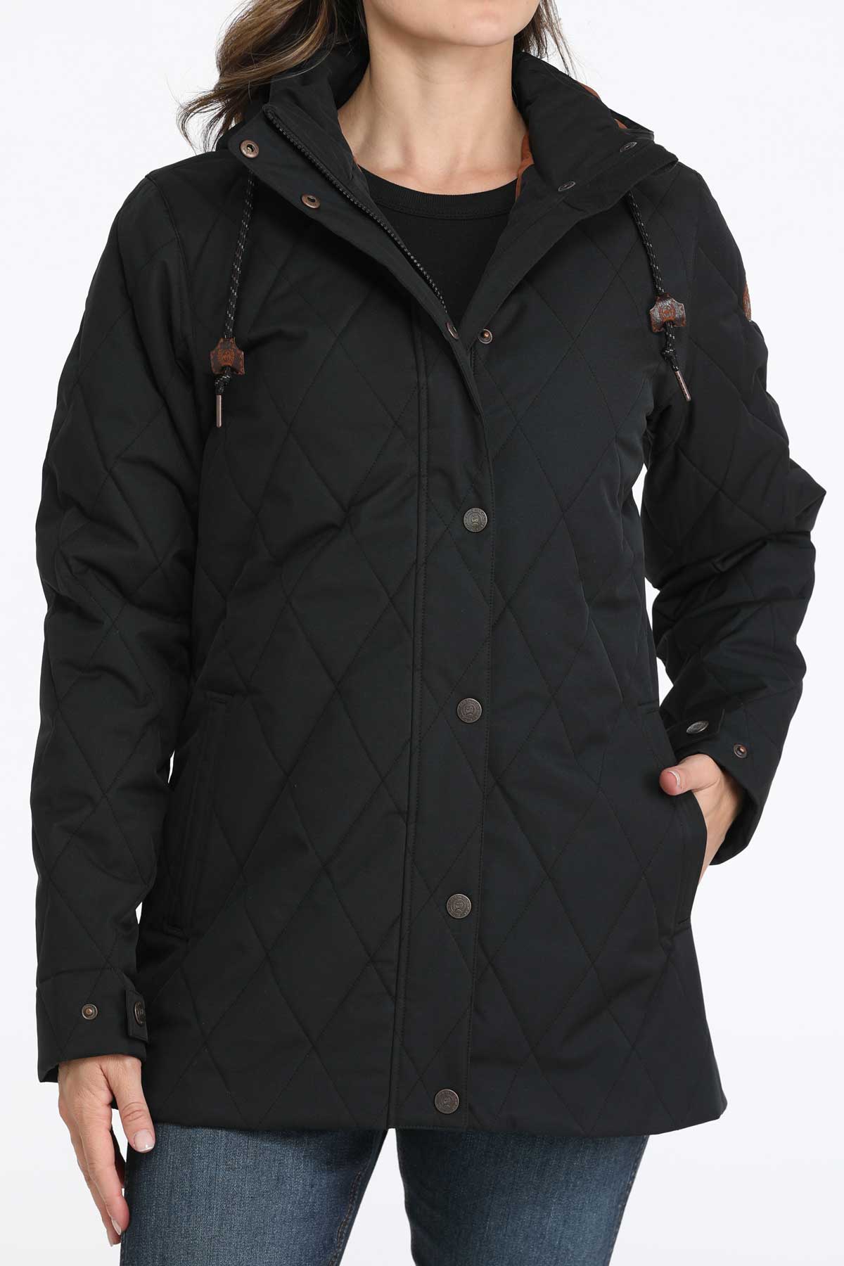 Woman wearing a black coat with jeans 