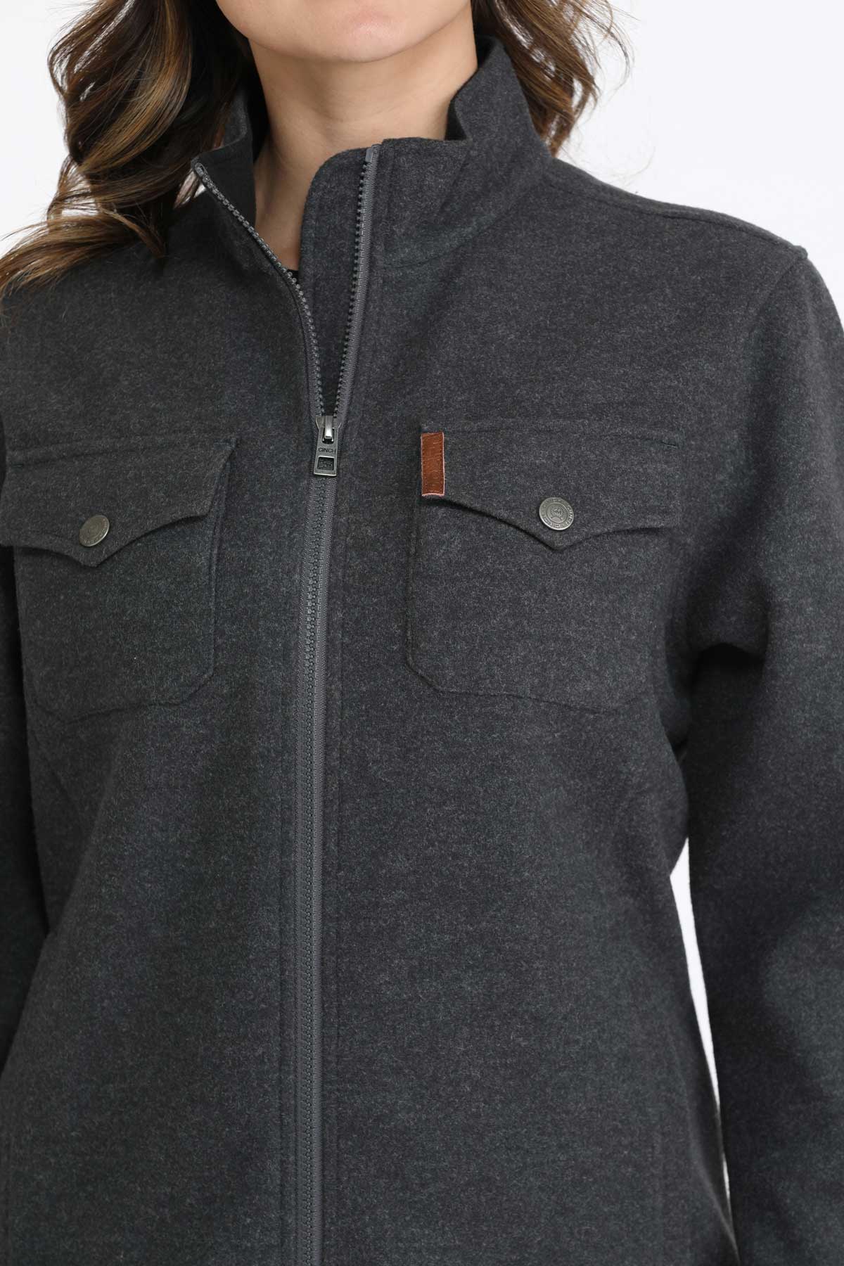 Close-up of a woman wearing a gray jacket 