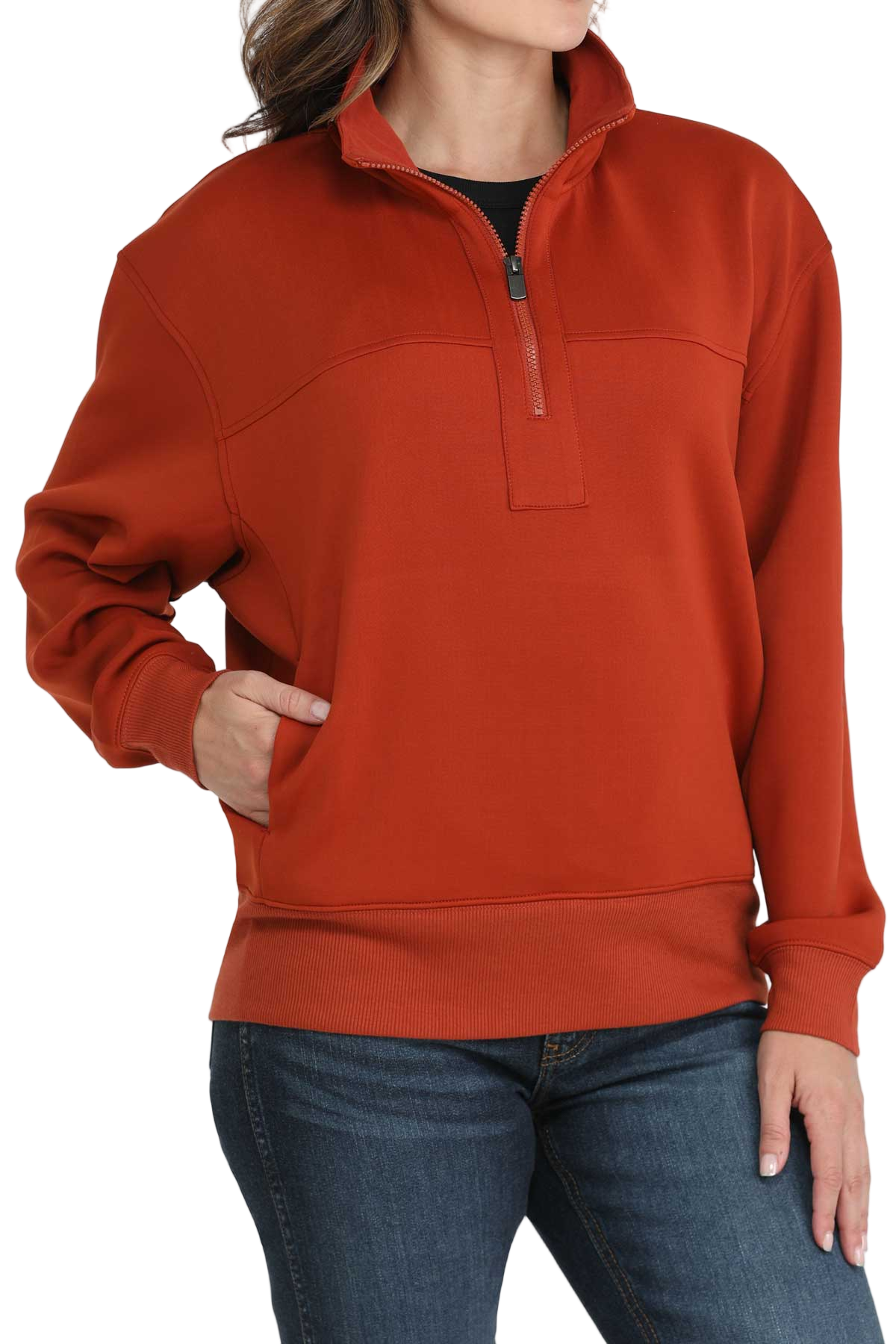 Woman wearing a red quarter-zip pullover with ribbed cuffs and hem, paired with dark-wash jeans