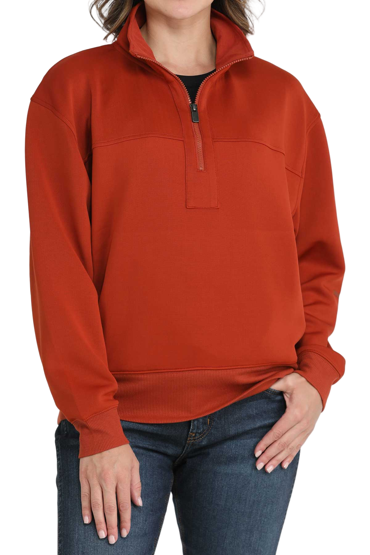 Woman wearing a red quarter-zip pullover with ribbed cuffs and hem, paired with dark-wash jeans