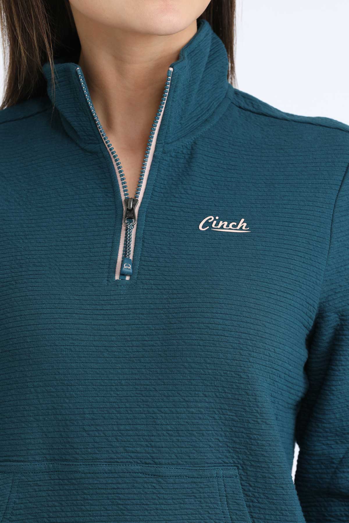 Teal pullover with a zipper and 'Cinch' logo on a white background