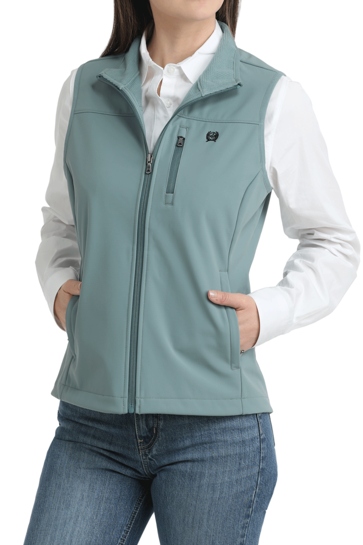 Person wearing a light blue vest over a white shirt and jeans on a white background