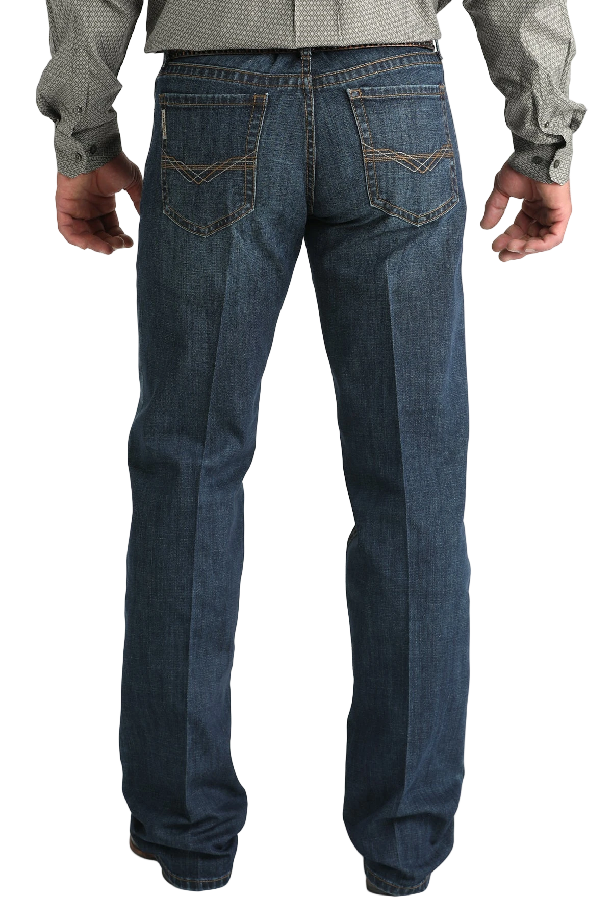 Blue jeans worn by a person on a white background