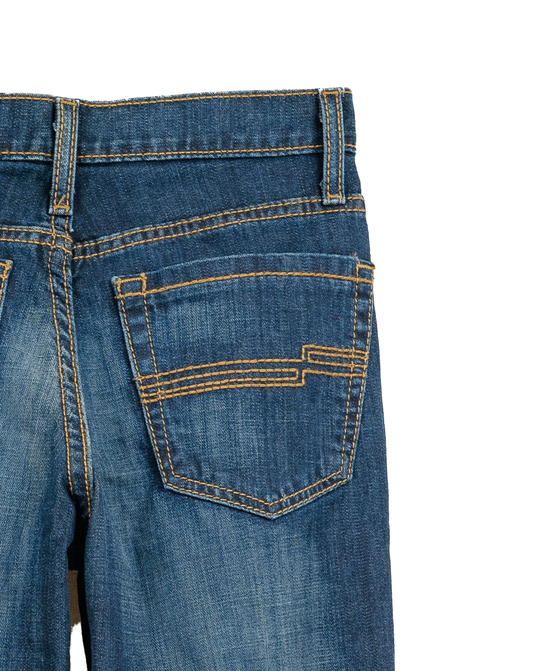 Close-up of blue jeans with a white background