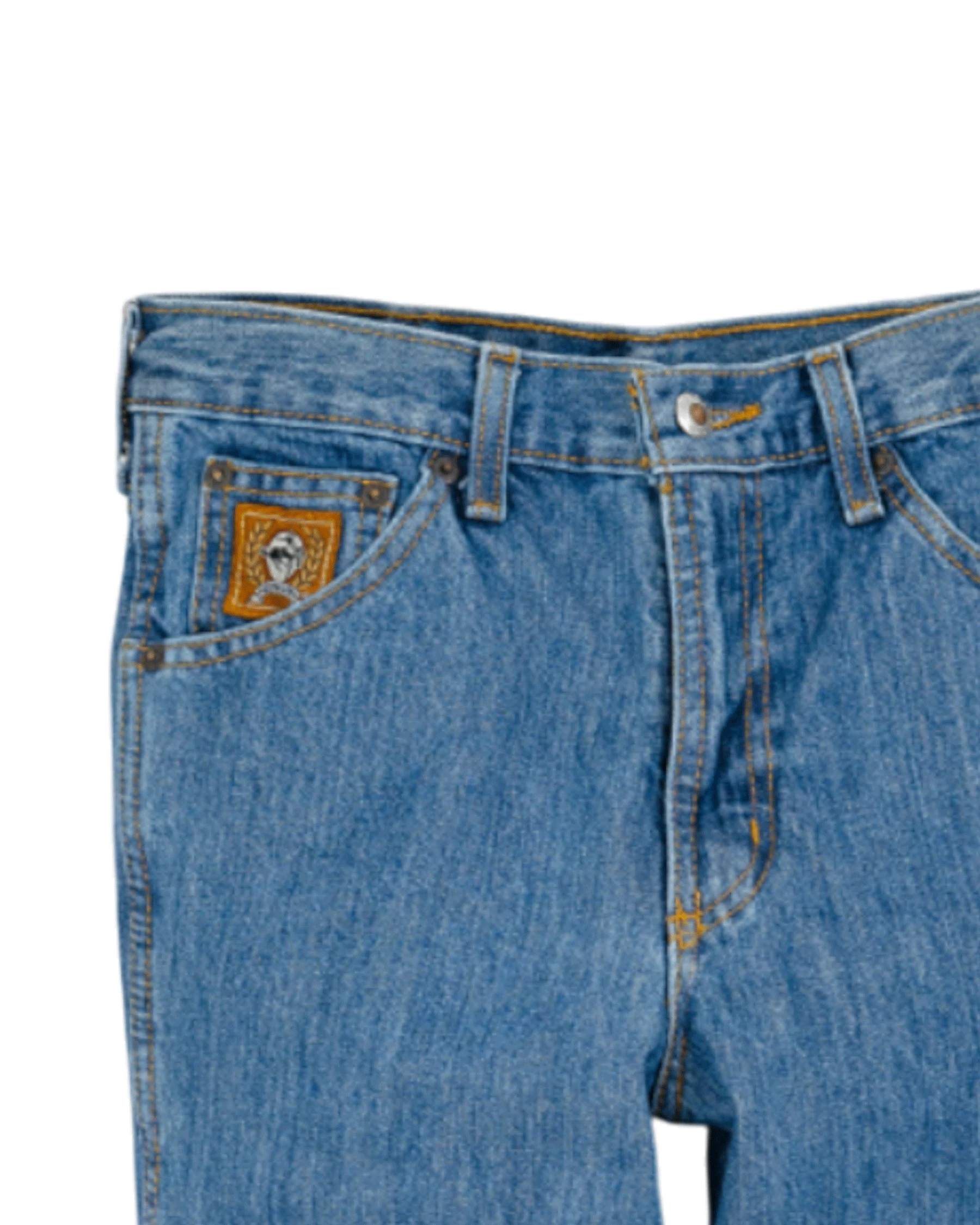 Close-up of blue jeans with a brand logo on the pocket against a white background