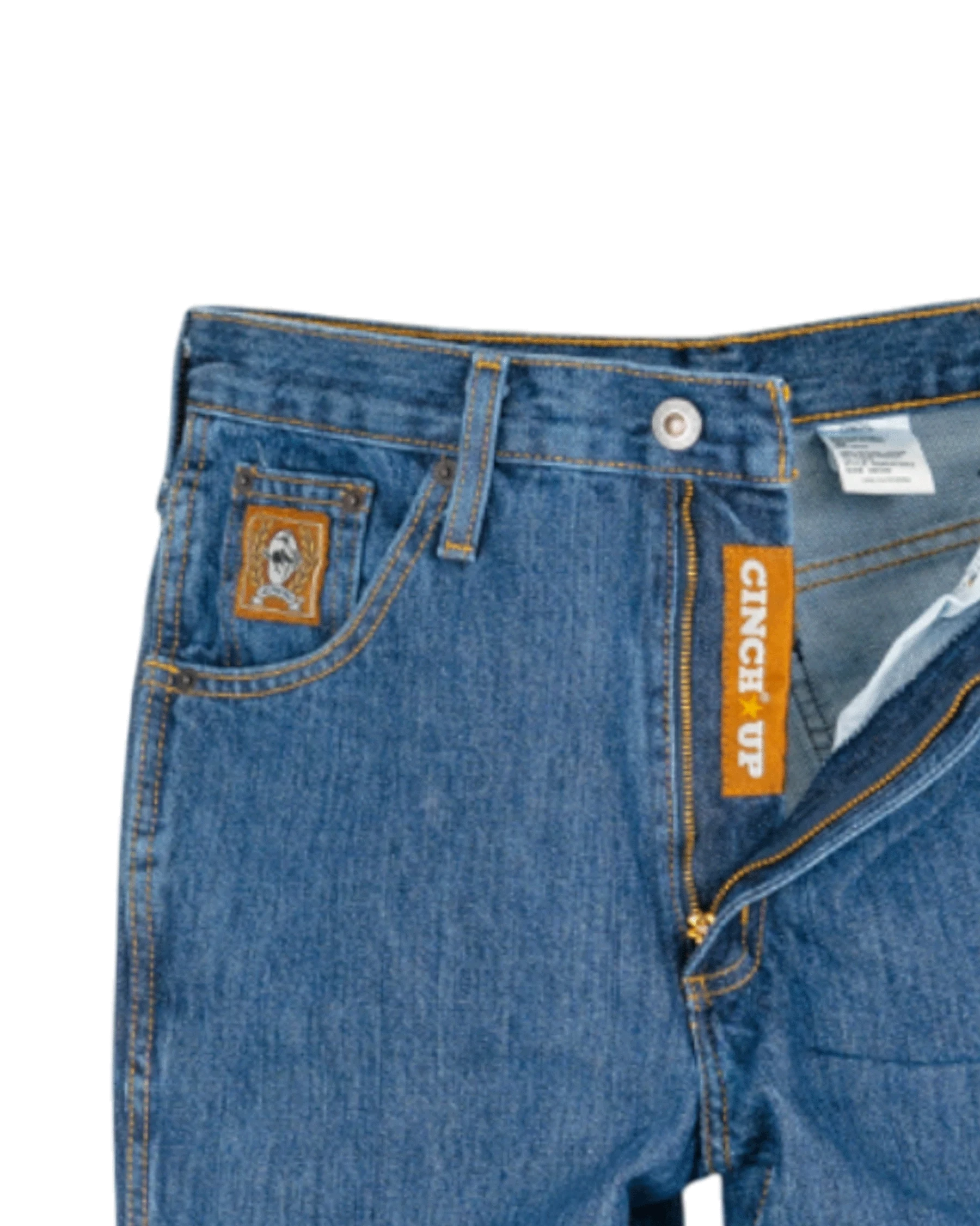 Close-up of blue jeans with a brand label on a white background