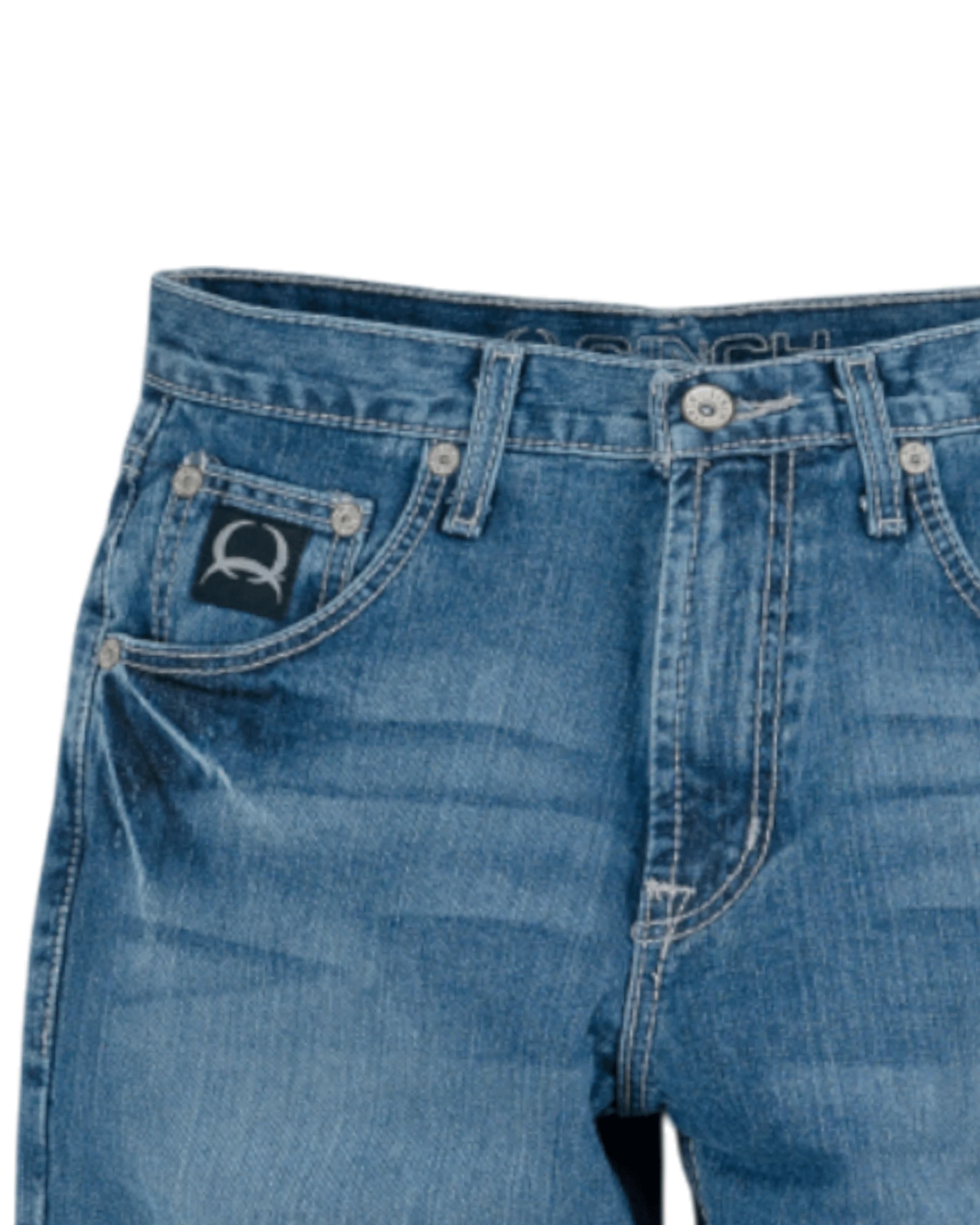 Close-up of blue jeans with a brand logo on a white background