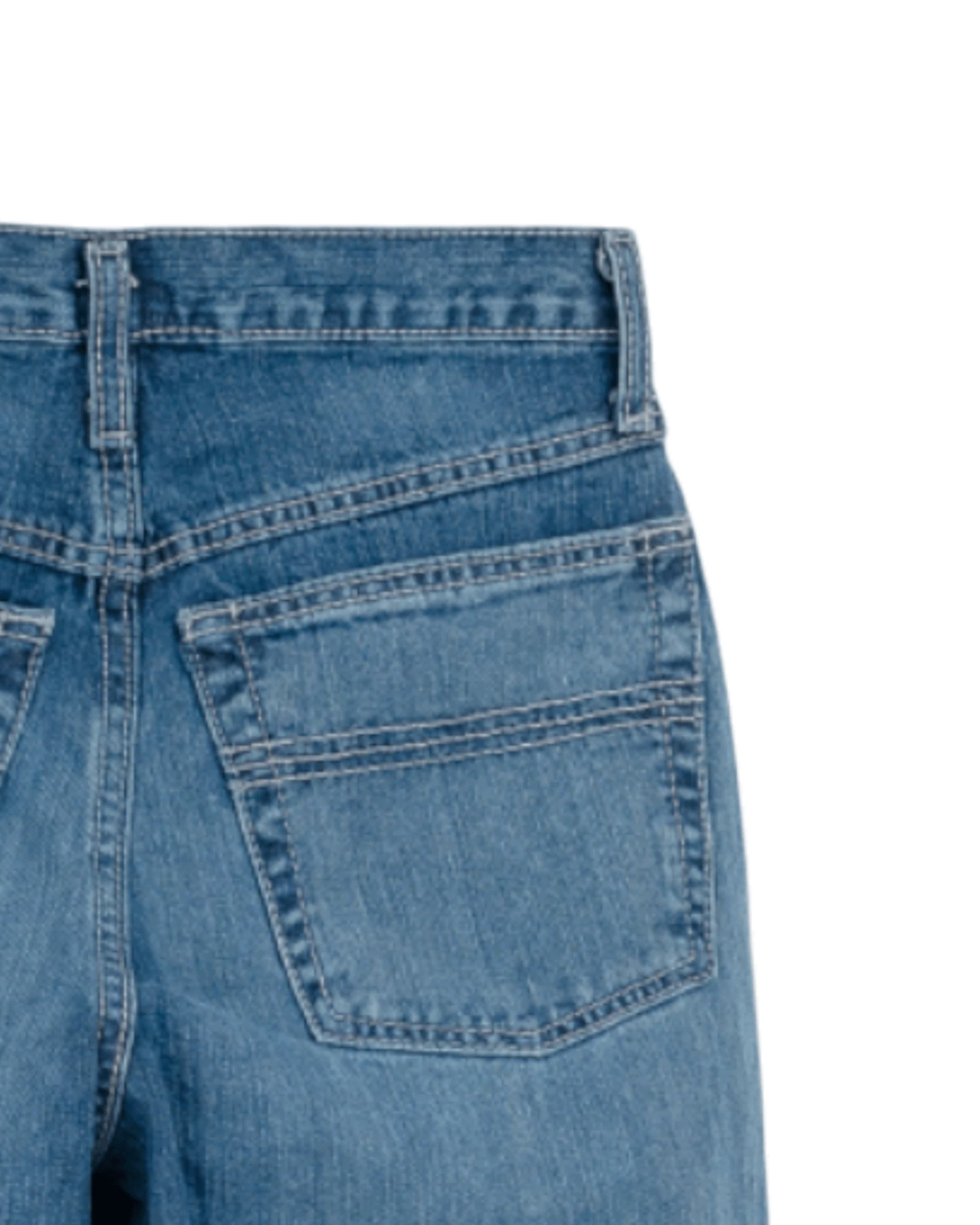 Close-up of blue denim jeans on a white background